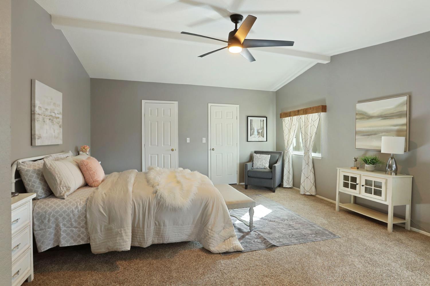 3320 Durham Ferry Road Tracy, CA 95304 - Photo 38 of 77 a bedroom with a bed and a chandelier