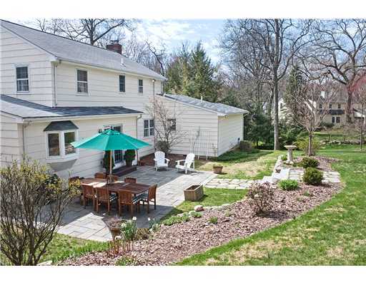 Undisclosed Address Darien, CT 06820 - Photo 2 of 9 a view of a house with backyard