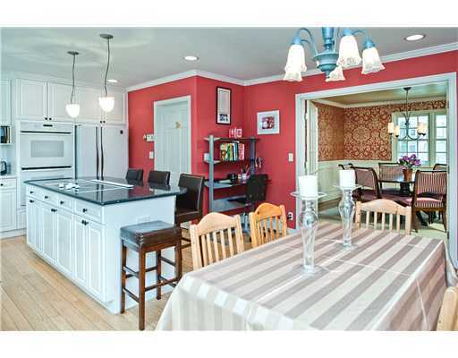 Undisclosed Address Darien, CT 06820 - Photo 7 of 9 a living room with furniture a fireplace and a dining table