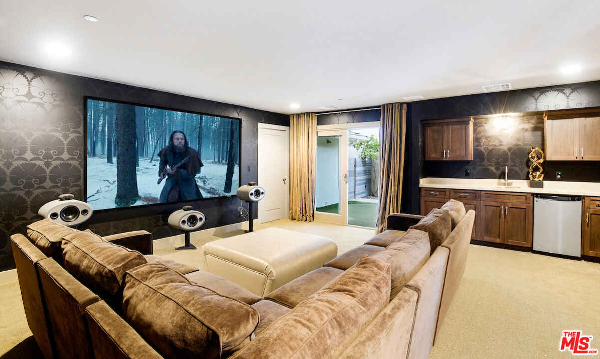 2547 Hutton Drive Beverly Hills, CA 90210 - Photo 11 of 27 a living room with furniture and a flat screen tv