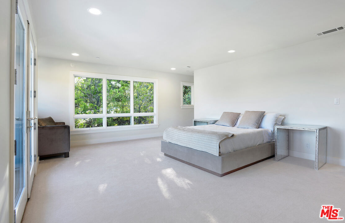 2547 Hutton Drive Beverly Hills, CA 90210 - Photo 14 of 27 a living room with furniture and a large window