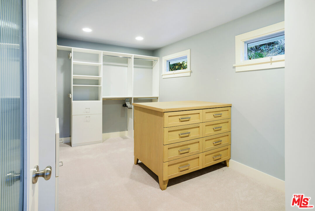 2547 Hutton Drive Beverly Hills, CA 90210 - Photo 19 of 27 a view of walk in closet with cabinet