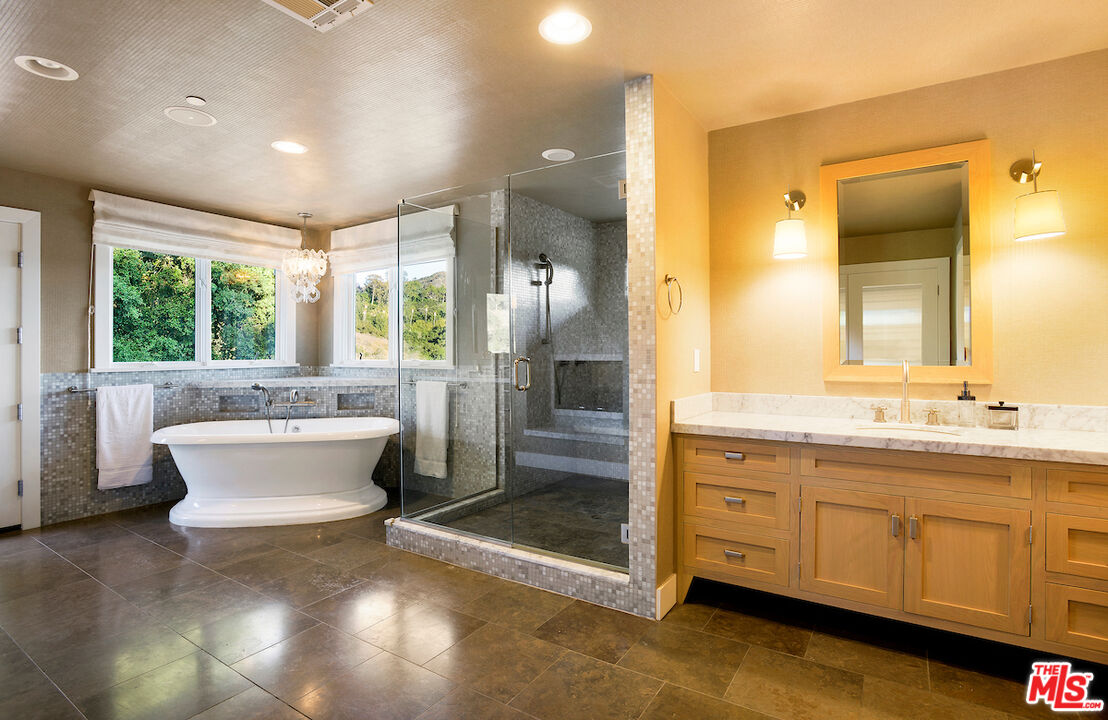 2547 Hutton Drive Beverly Hills, CA 90210 - Photo 20 of 27 a view of a bathroom with a tub sink shower and mirror