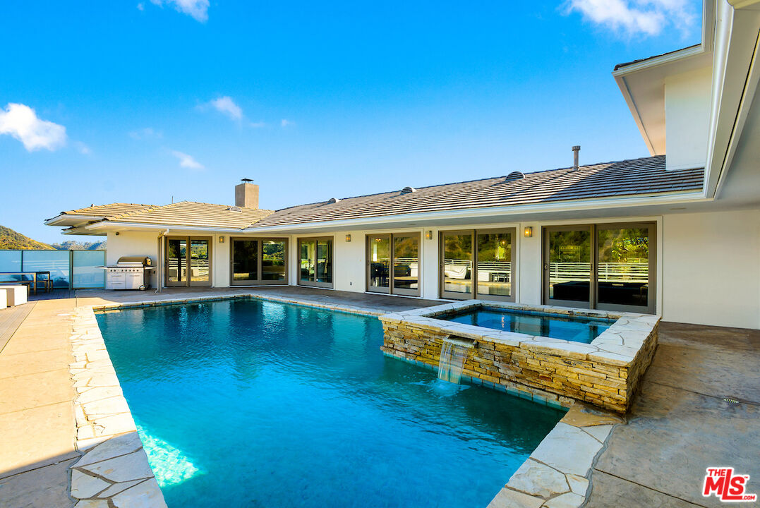 2547 Hutton Drive Beverly Hills, CA 90210 - Photo 25 of 27 a view of a house with swimming pool in front of it