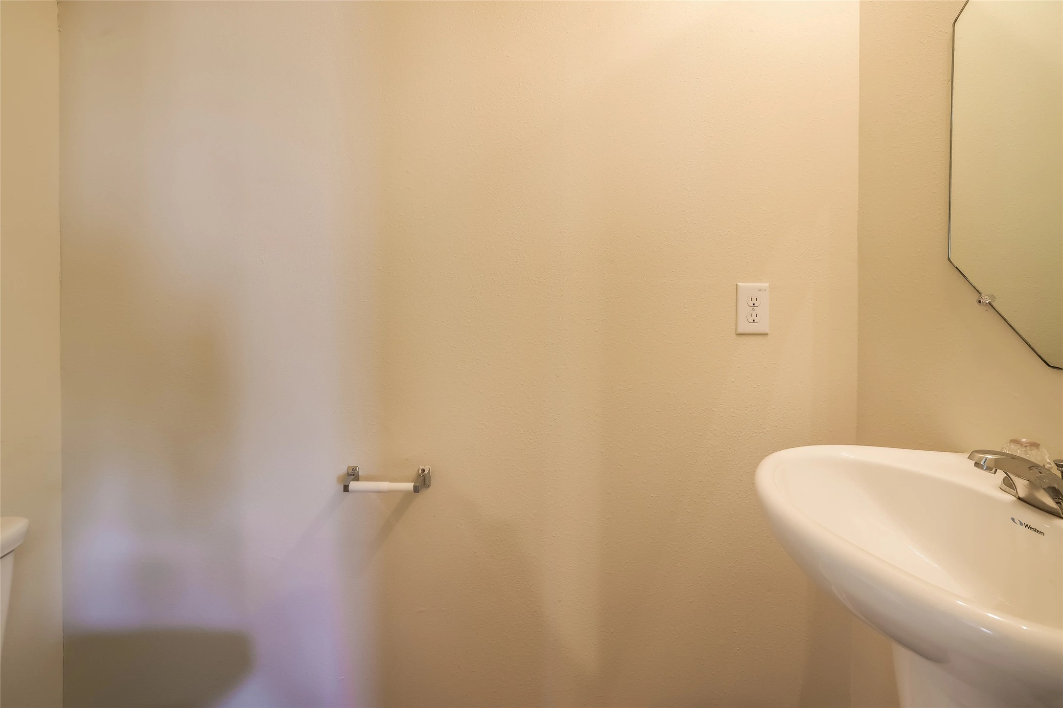14438 Acuna Lane Houston, TX 77045 - Photo 7 of 15 a bathroom with a sink and mirror
