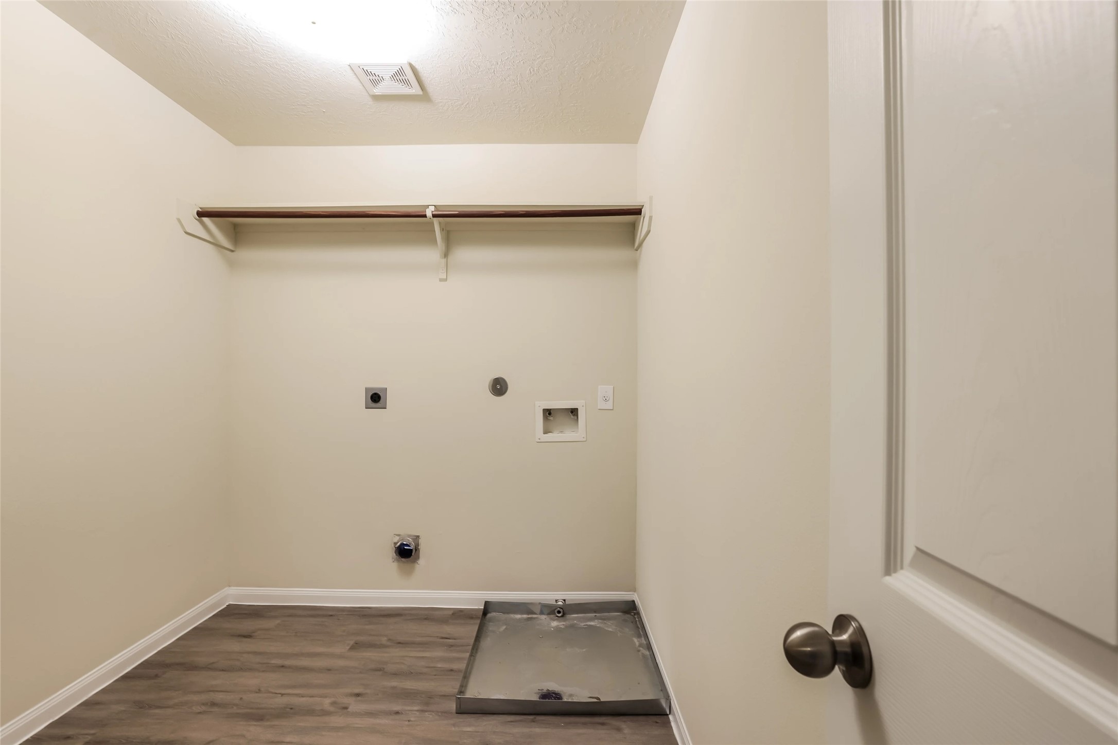 14438 Acuna Lane Houston, TX 77045 - Photo 10 of 15 a view of a room with rack on the wall