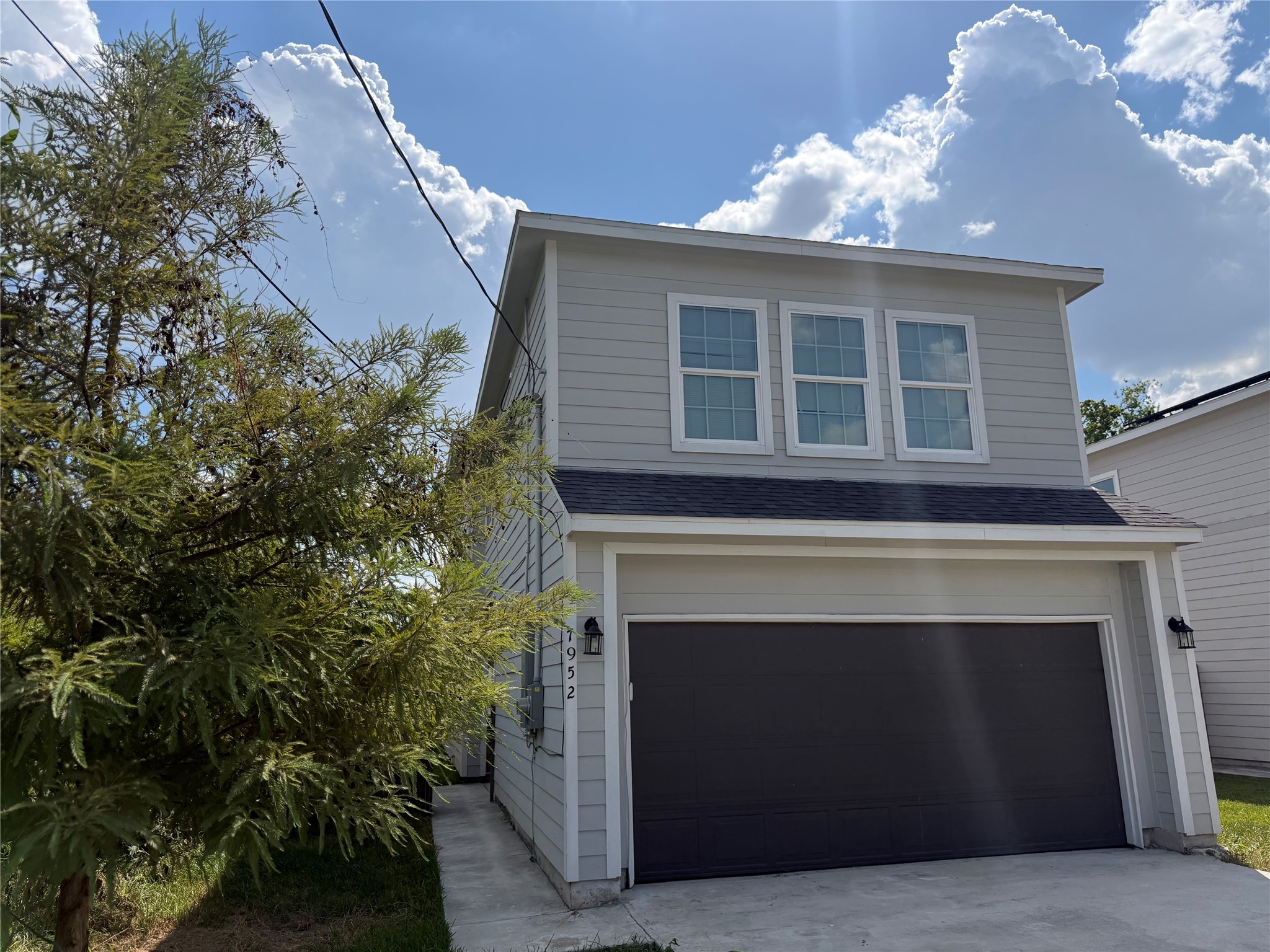 7952 Blue Street Houston, TX 77028 - Photo 1 of 14 a front view of a house with a garage