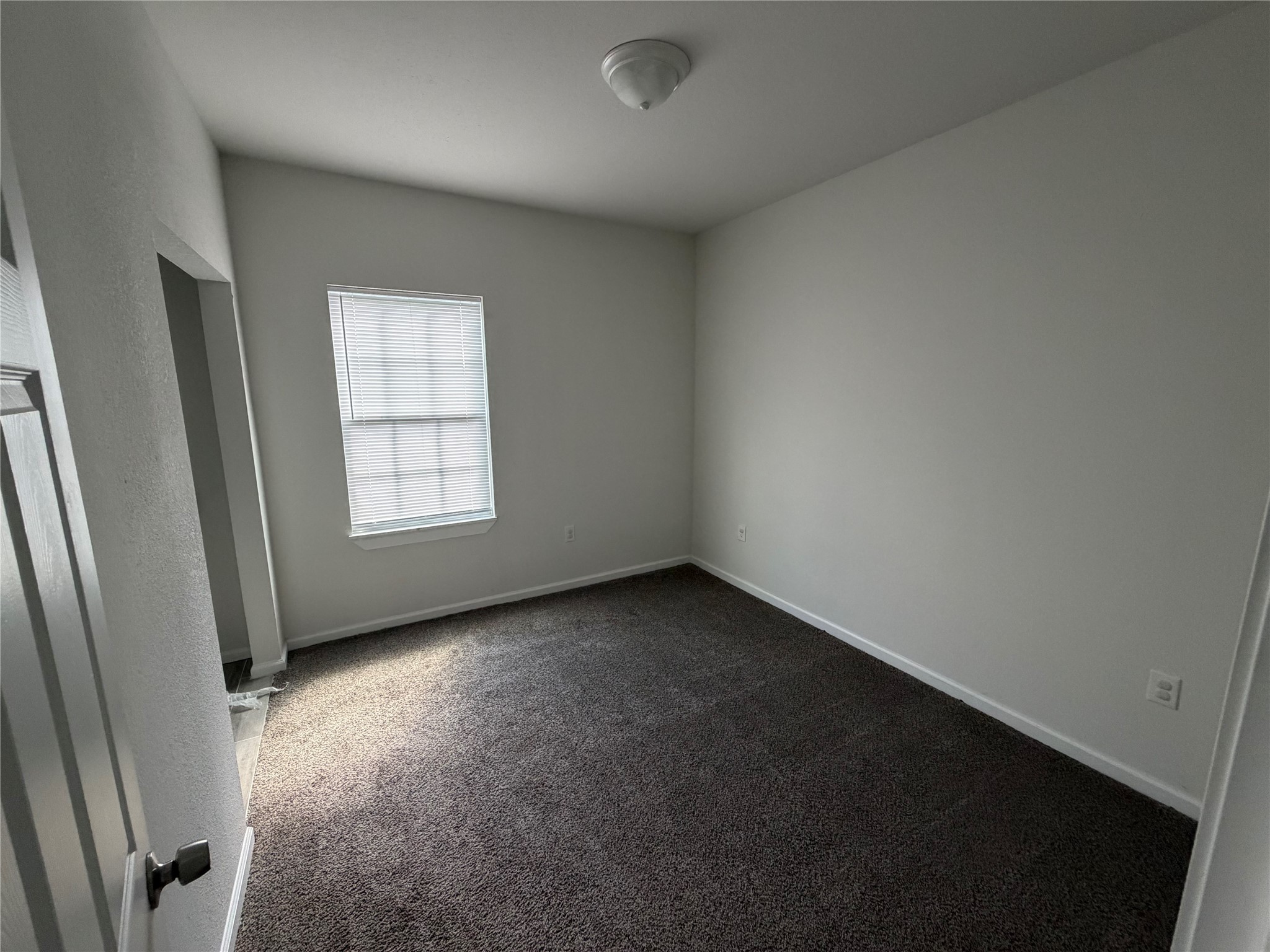 7952 Blue Street Houston, TX 77028 - Photo 14 of 14 an empty room with windows
