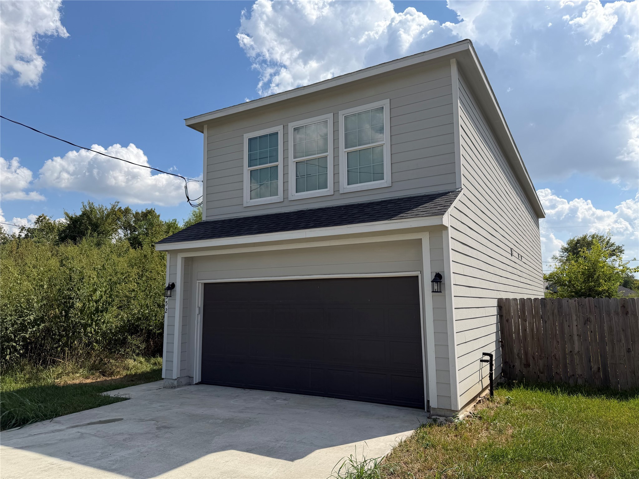 7952 Blue Street Houston, TX 77028 - Photo 2 of 14 a front view of a house with a garage