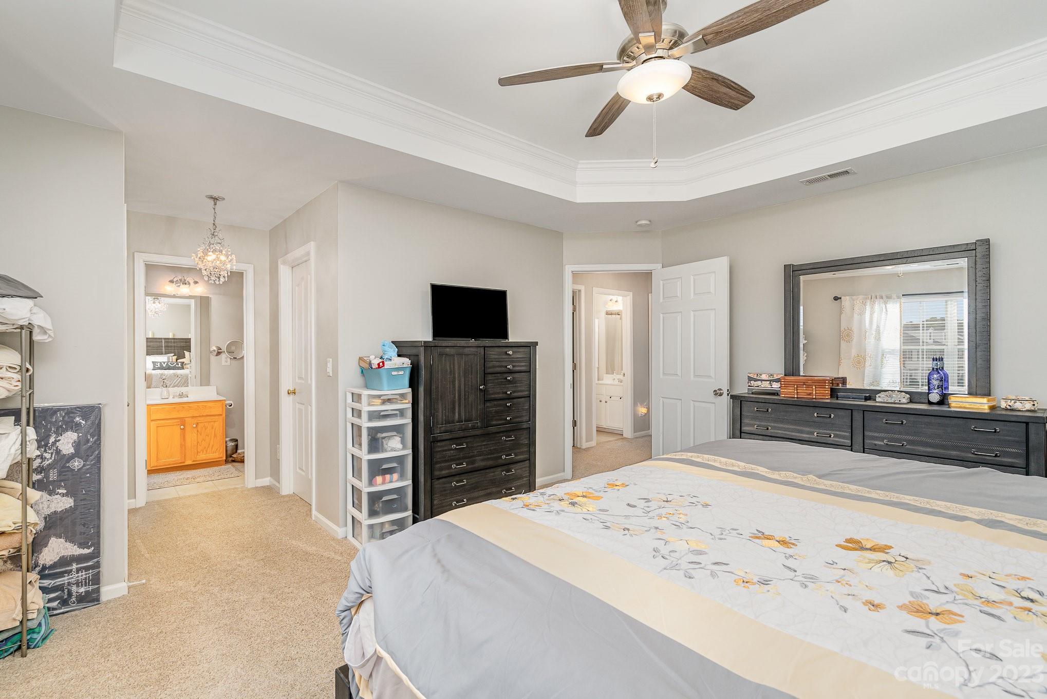 7572 Bluff Point Lane Denver, NC 28037 - Photo 20 of 33 a bedroom with a bed and a television