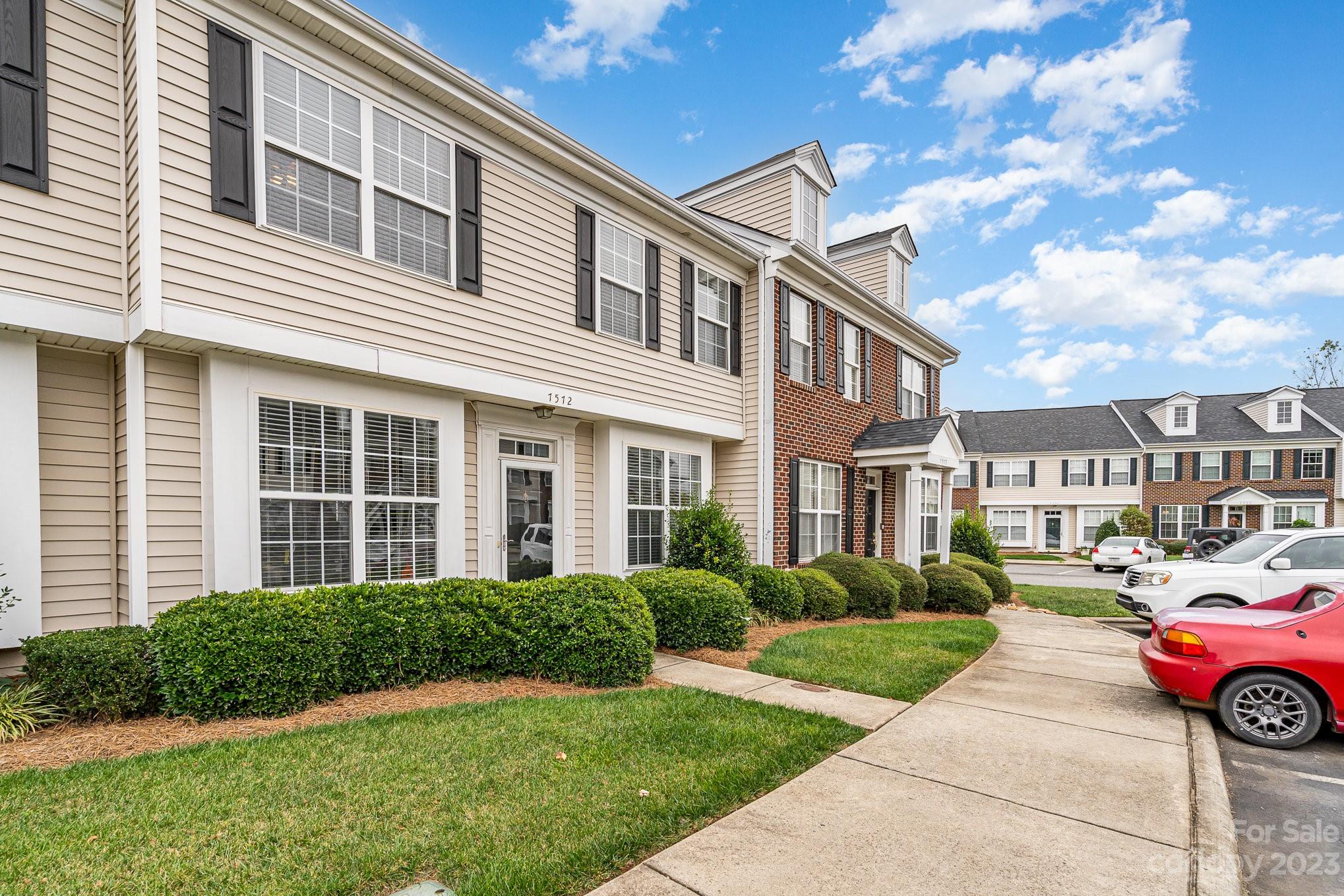 7572 Bluff Point Lane Denver, NC 28037 - Photo 2 of 33 a front view of a house with garden and outdoor seating