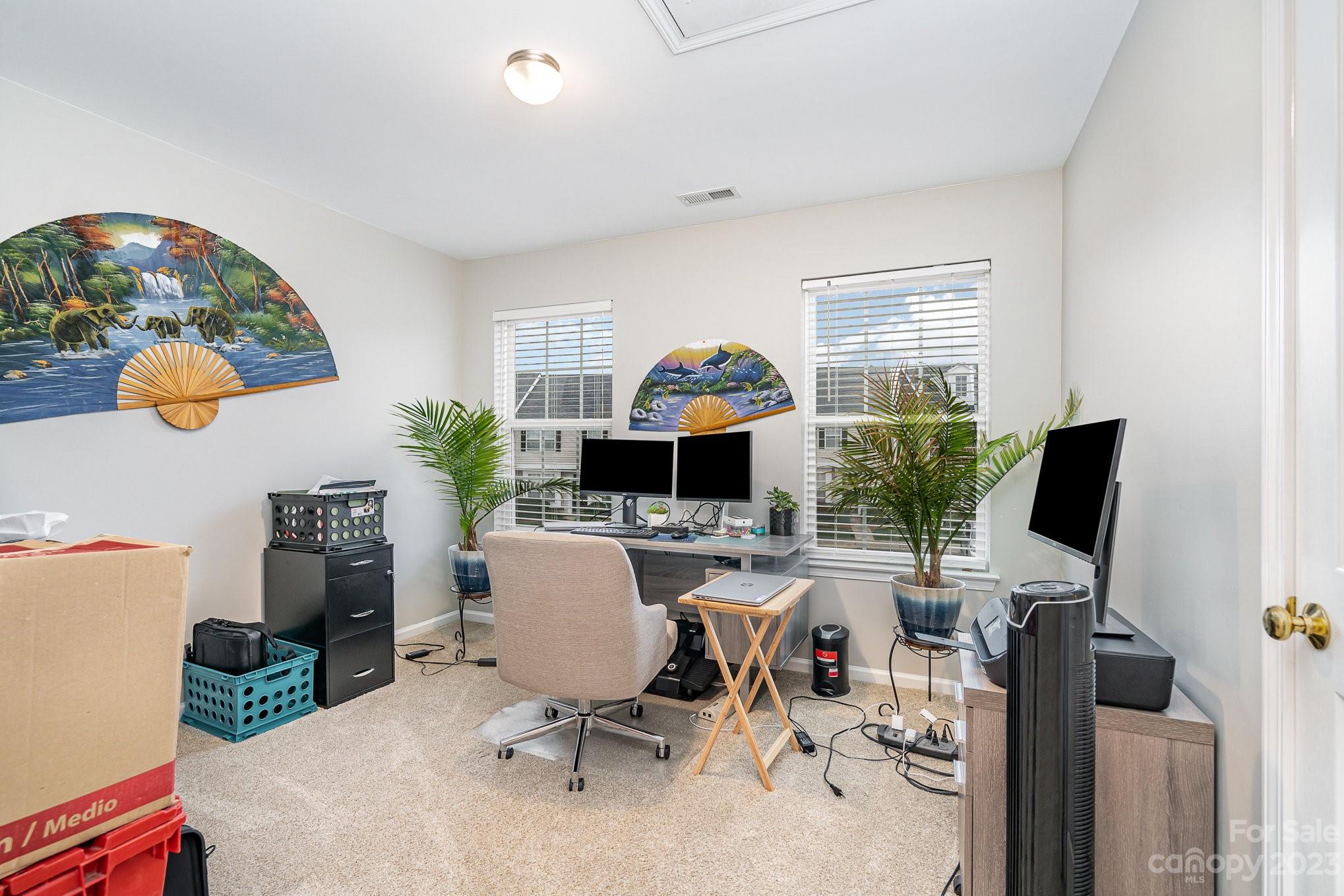 7572 Bluff Point Lane Denver, NC 28037 - Photo 26 of 33 a view of a workspace with a window and lounge chair