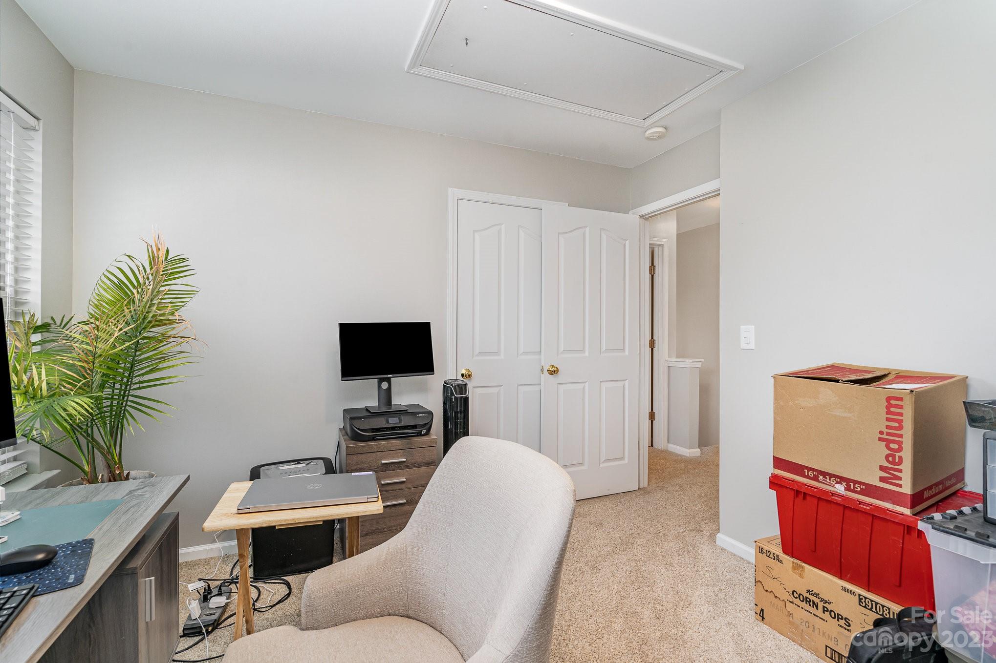 7572 Bluff Point Lane Denver, NC 28037 - Photo 27 of 33 a living room with furniture and a flat screen tv
