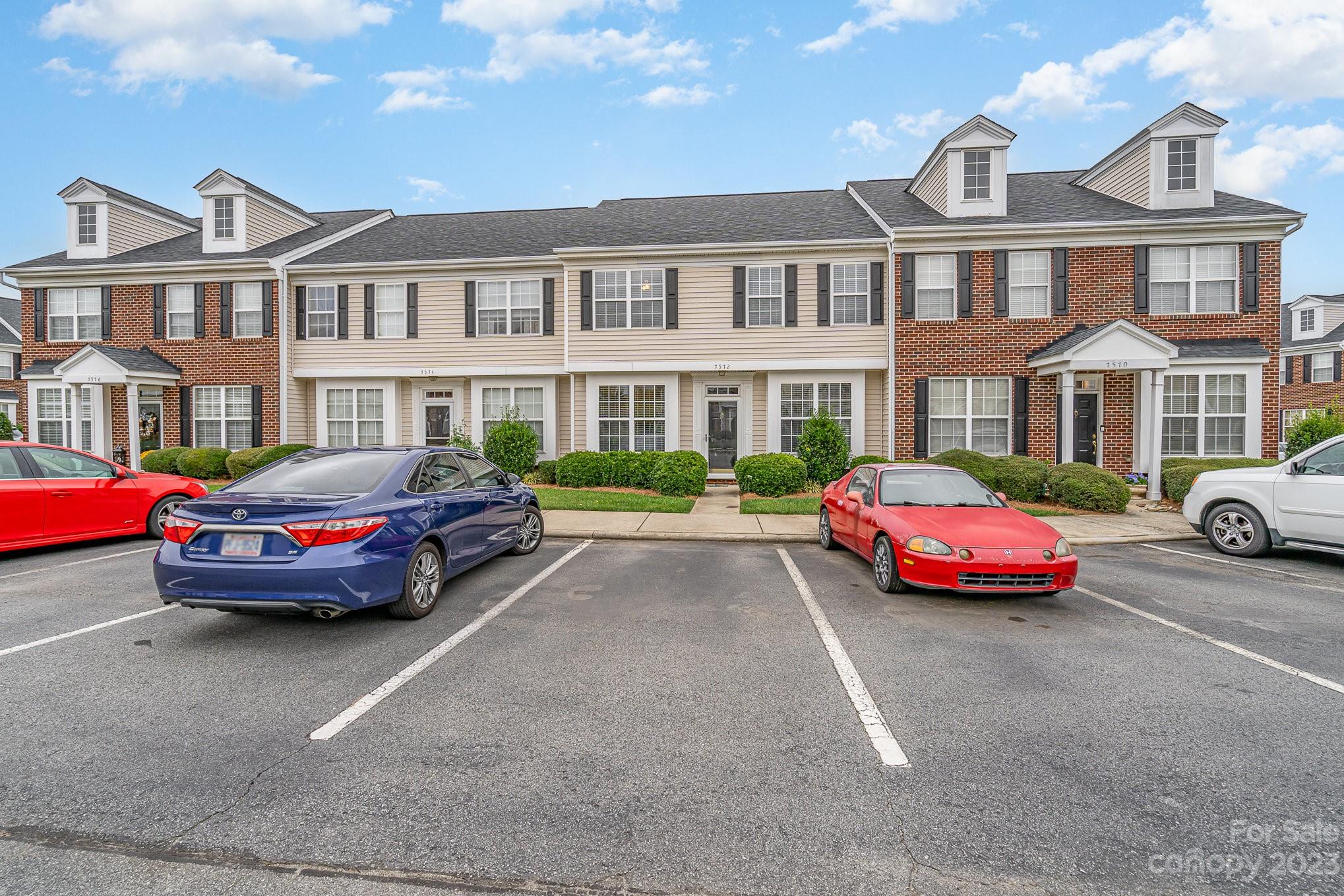 7572 Bluff Point Lane Denver, NC 28037 - Photo 3 of 33 a cars parked in front of a white house