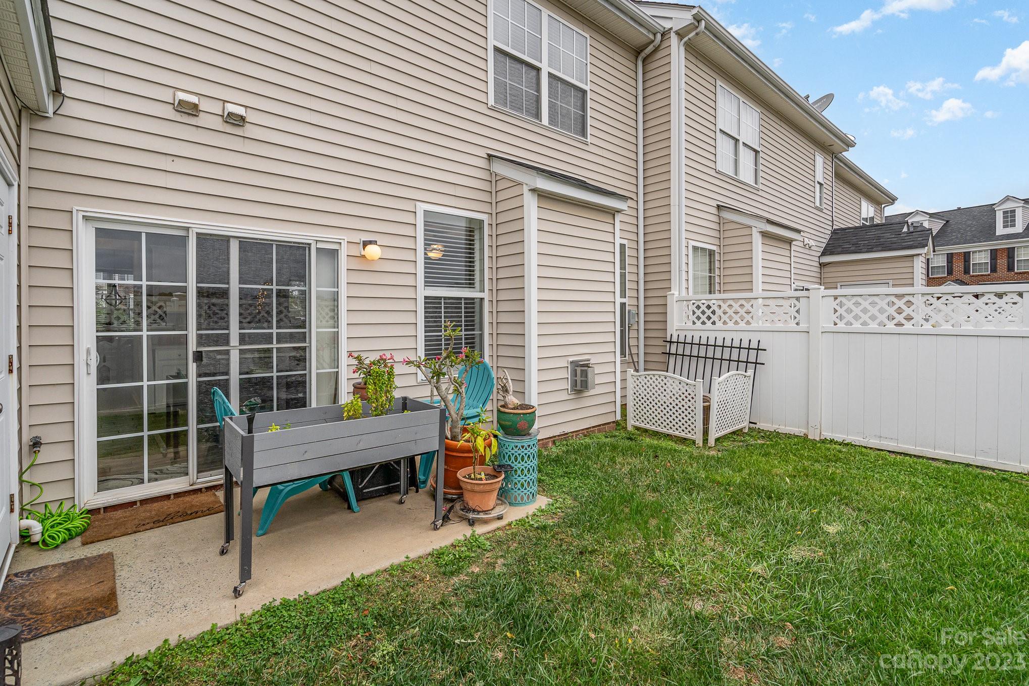 7572 Bluff Point Lane Denver, NC 28037 - Photo 31 of 33 a wooden bench sitting in front of a house