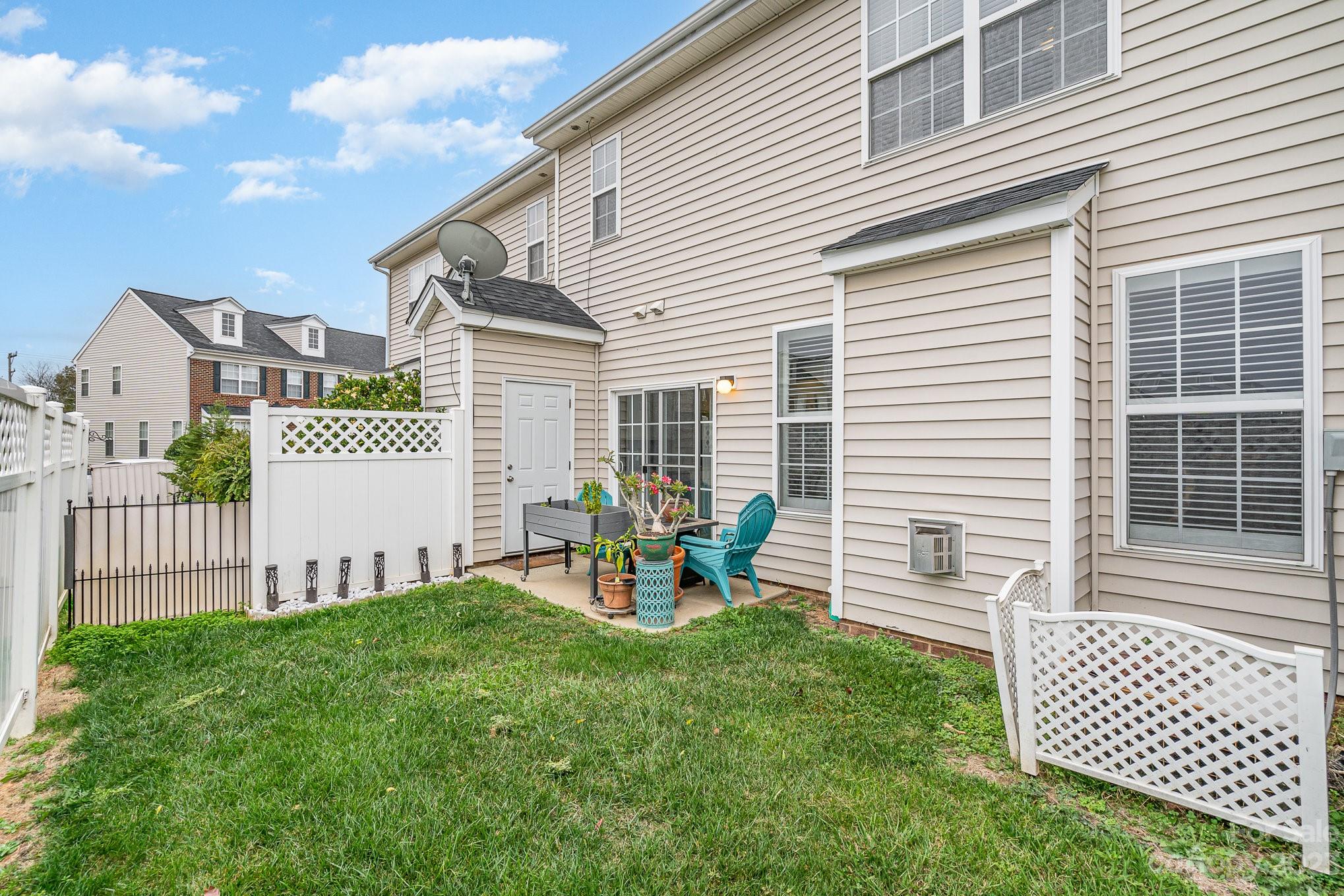 7572 Bluff Point Lane Denver, NC 28037 - Photo 32 of 33 a view of a chair and table in the back yard of the house