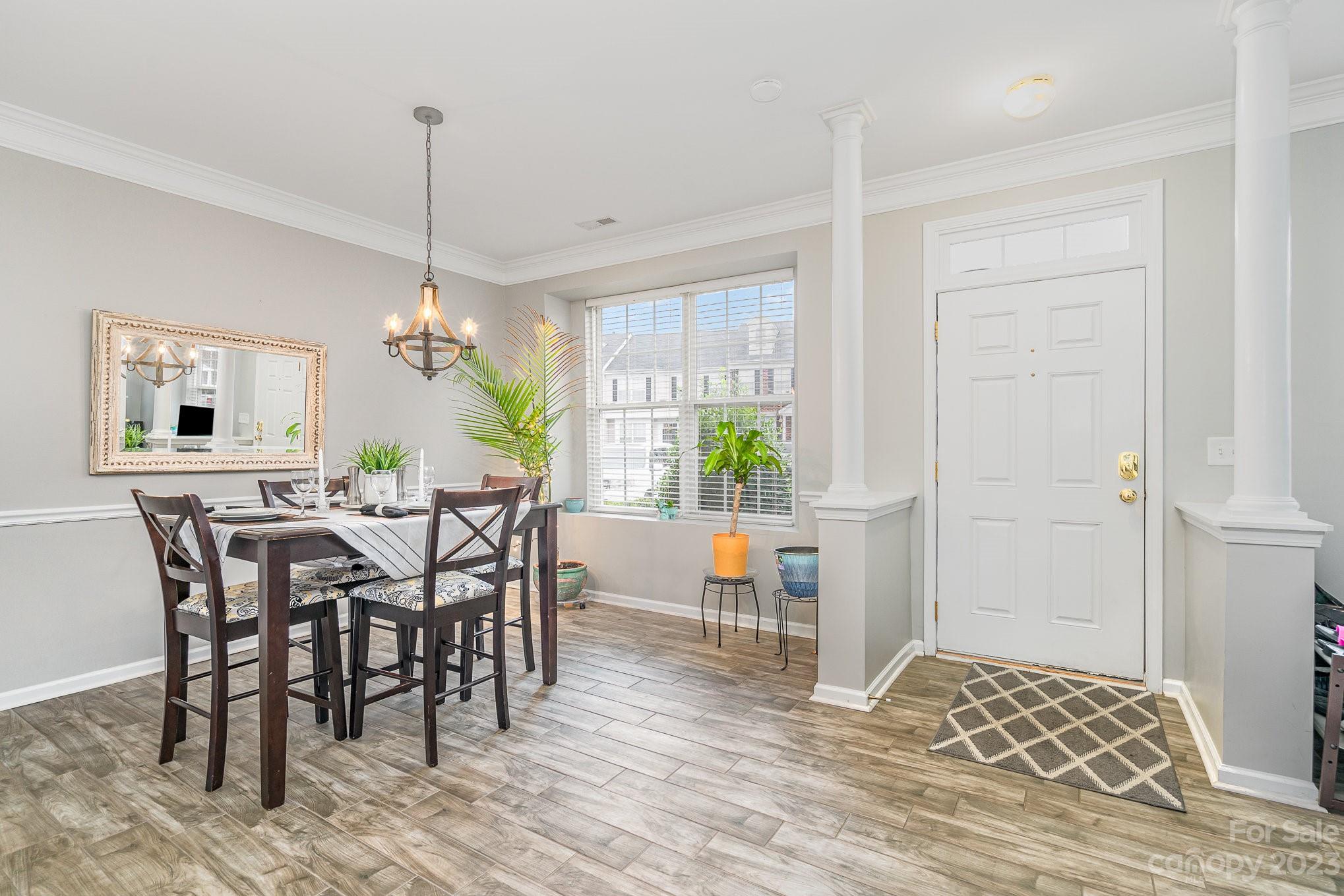 7572 Bluff Point Lane Denver, NC 28037 - Photo 4 of 33 a view of a dining room with furniture window and wooden floor