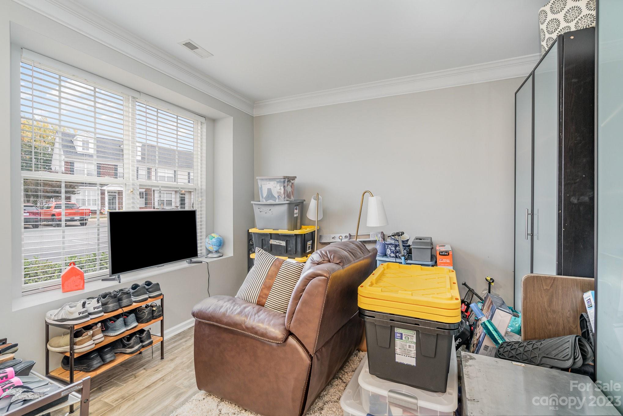 7572 Bluff Point Lane Denver, NC 28037 - Photo 8 of 33 a living room with furniture and a flat screen tv