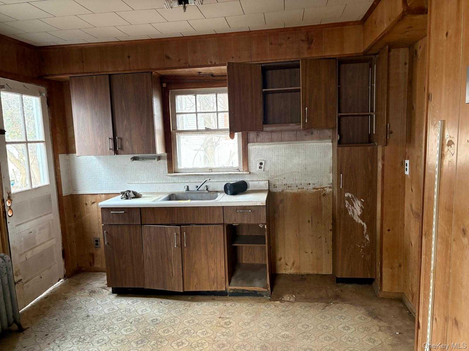 19 Lacrosse Road Mastic Beach, NY 11951 - Photo 14 of 15 a bathroom with a sink and a mirror
