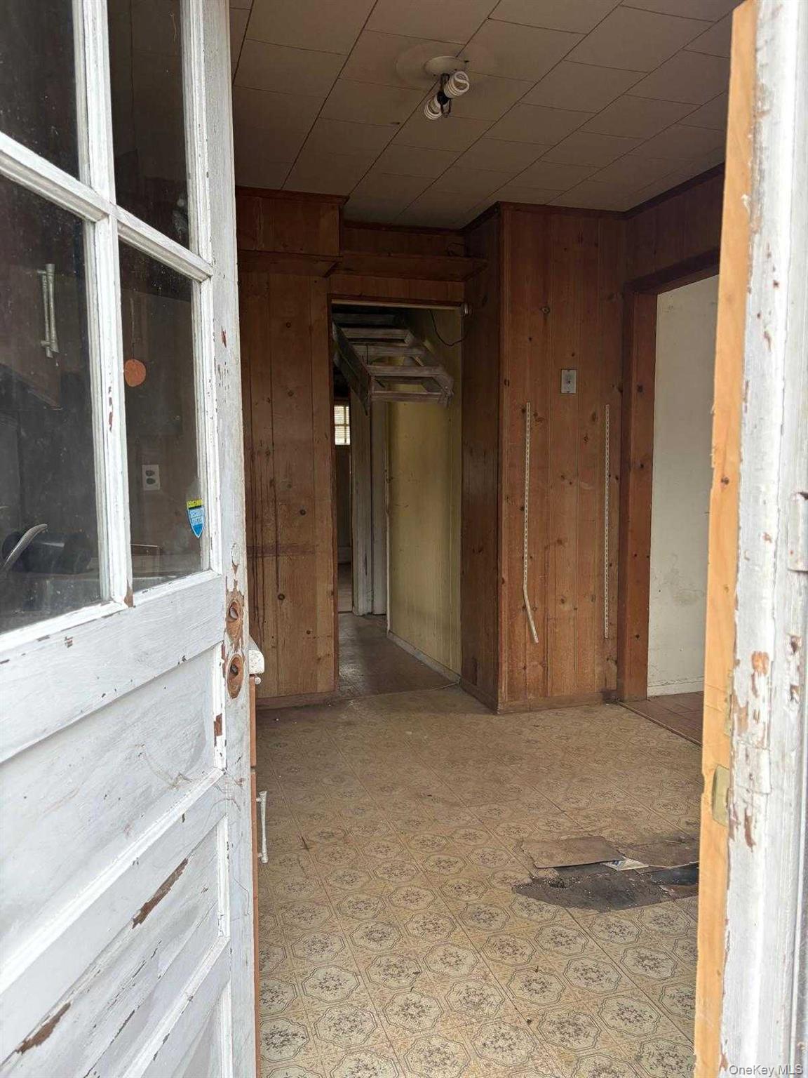 19 Lacrosse Road Mastic Beach, NY 11951 - Photo 15 of 15 a view of an empty room with a fireplace and a window