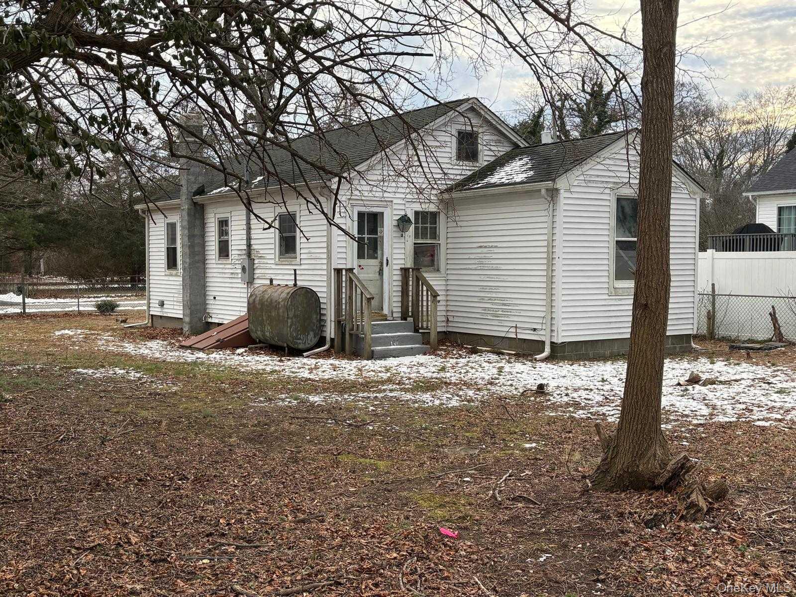 19 Lacrosse Road Mastic Beach, NY 11951 - Photo 2 of 15 a view of a house with a yard