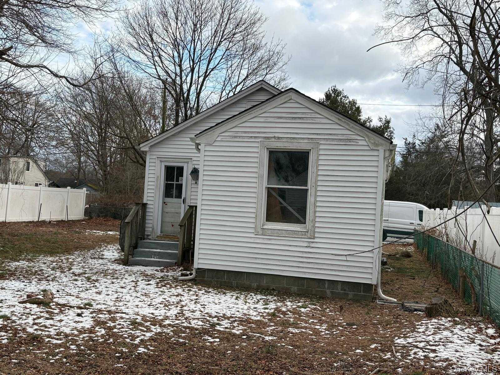 19 Lacrosse Road Mastic Beach, NY 11951 - Photo 5 of 15 a view of a house with a yard
