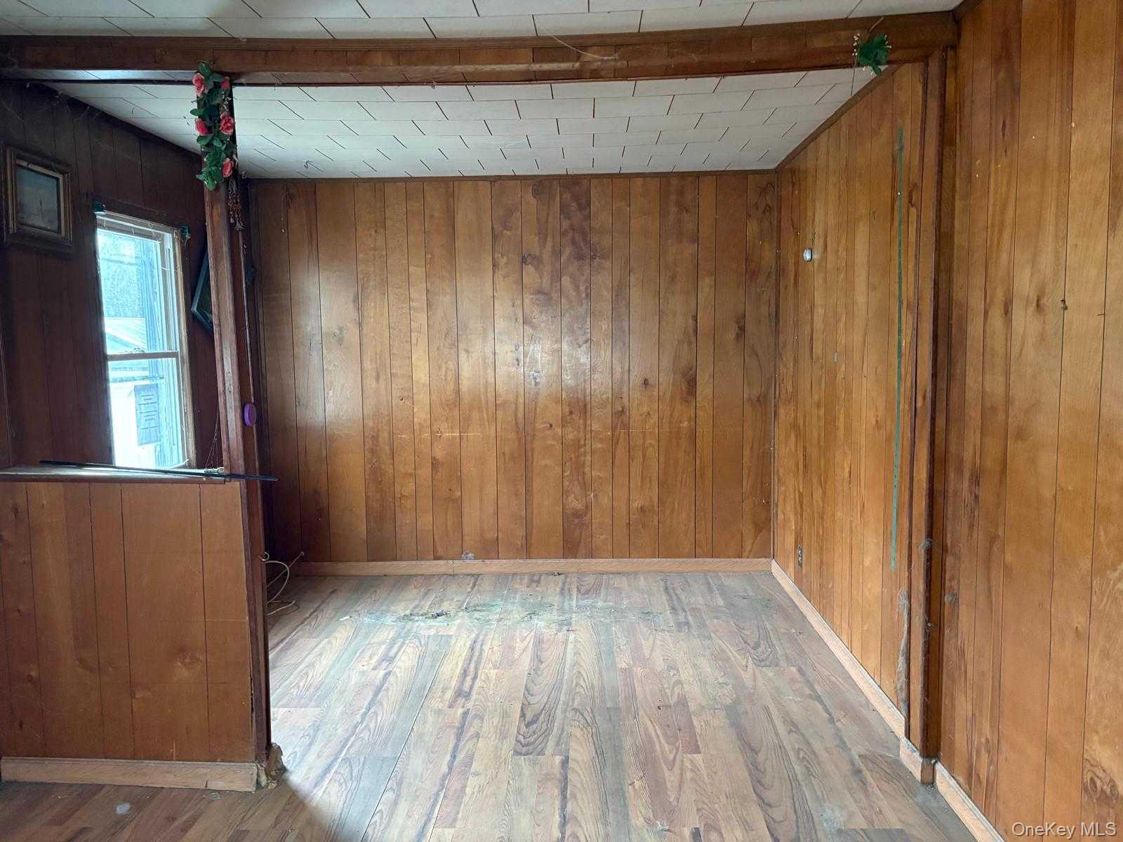 19 Lacrosse Road Mastic Beach, NY 11951 - Photo 6 of 15 a view of entryway with wooden floor
