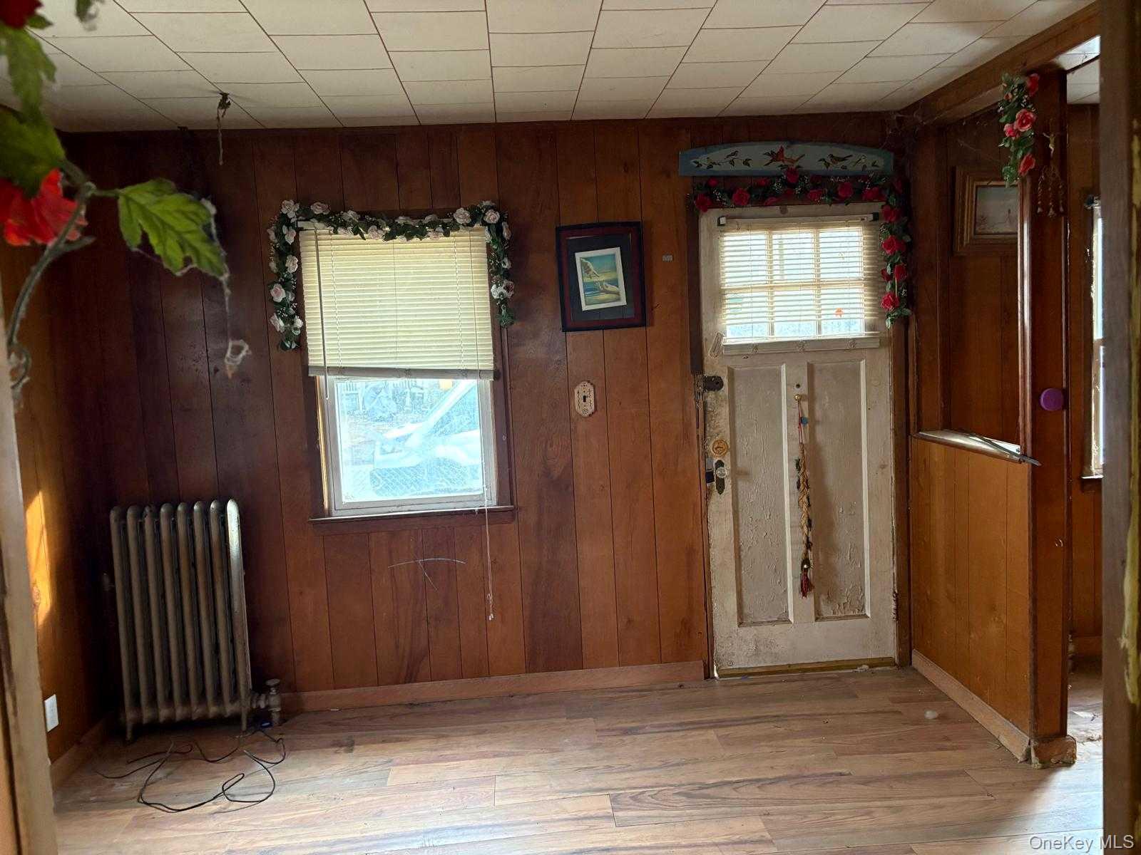 19 Lacrosse Road Mastic Beach, NY 11951 - Photo 10 of 15 an empty room with windows