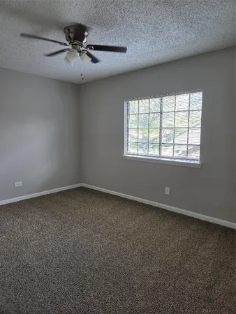 a bathroom with a granite countertop sink a toilet and a bathtub