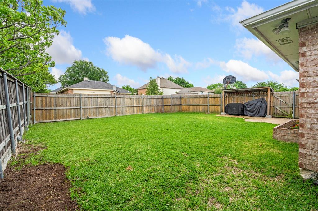2302 Randi Road Rowlett, TX 75088 - Photo 28 of 33 a view of a backyard with a garden and plants