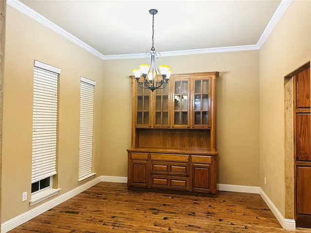 a kitchen with a refrigerator and cabinets