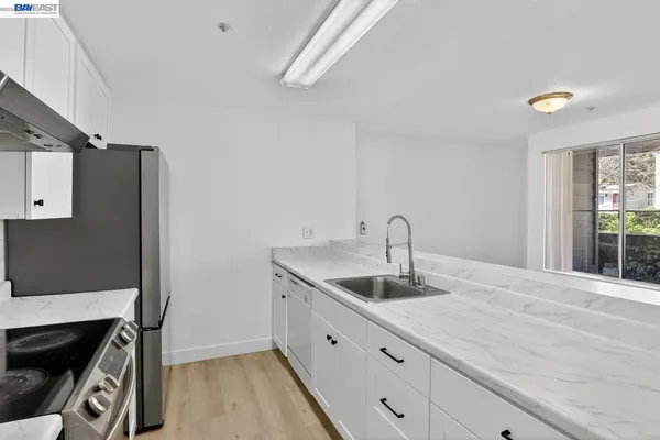 a kitchen with a sink and a window
