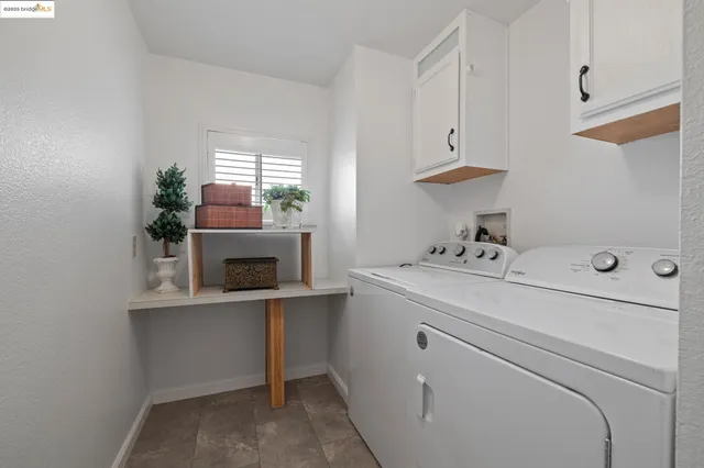 a view of storage and utility room with washer and dryer