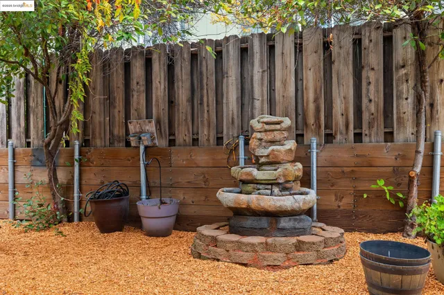 a view of a backyard with table and chairs