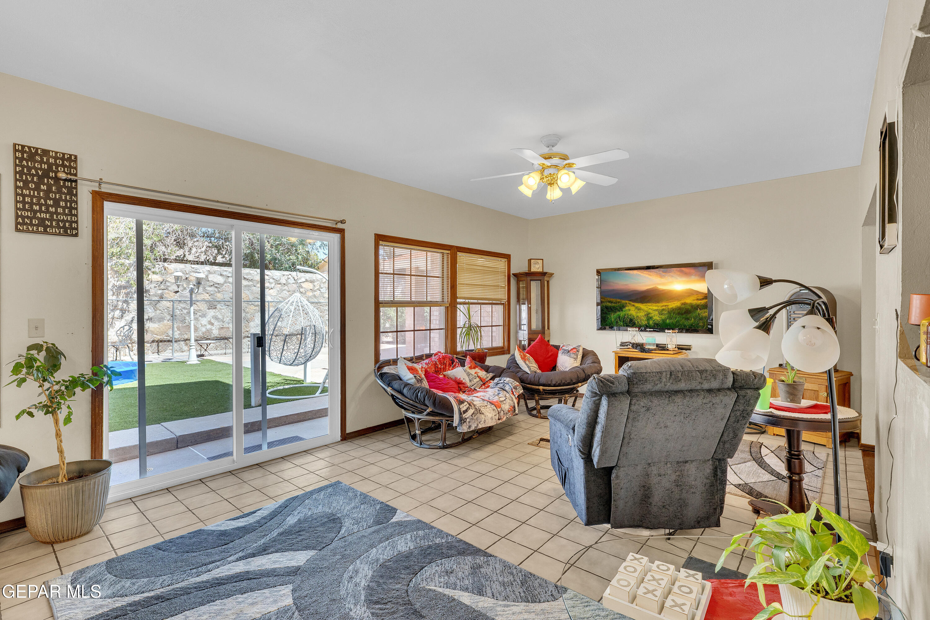 1664 Dick Ritter Street El Paso, TX 79936 - Photo 14 of 65 a living room with furniture a window and a flat screen tv