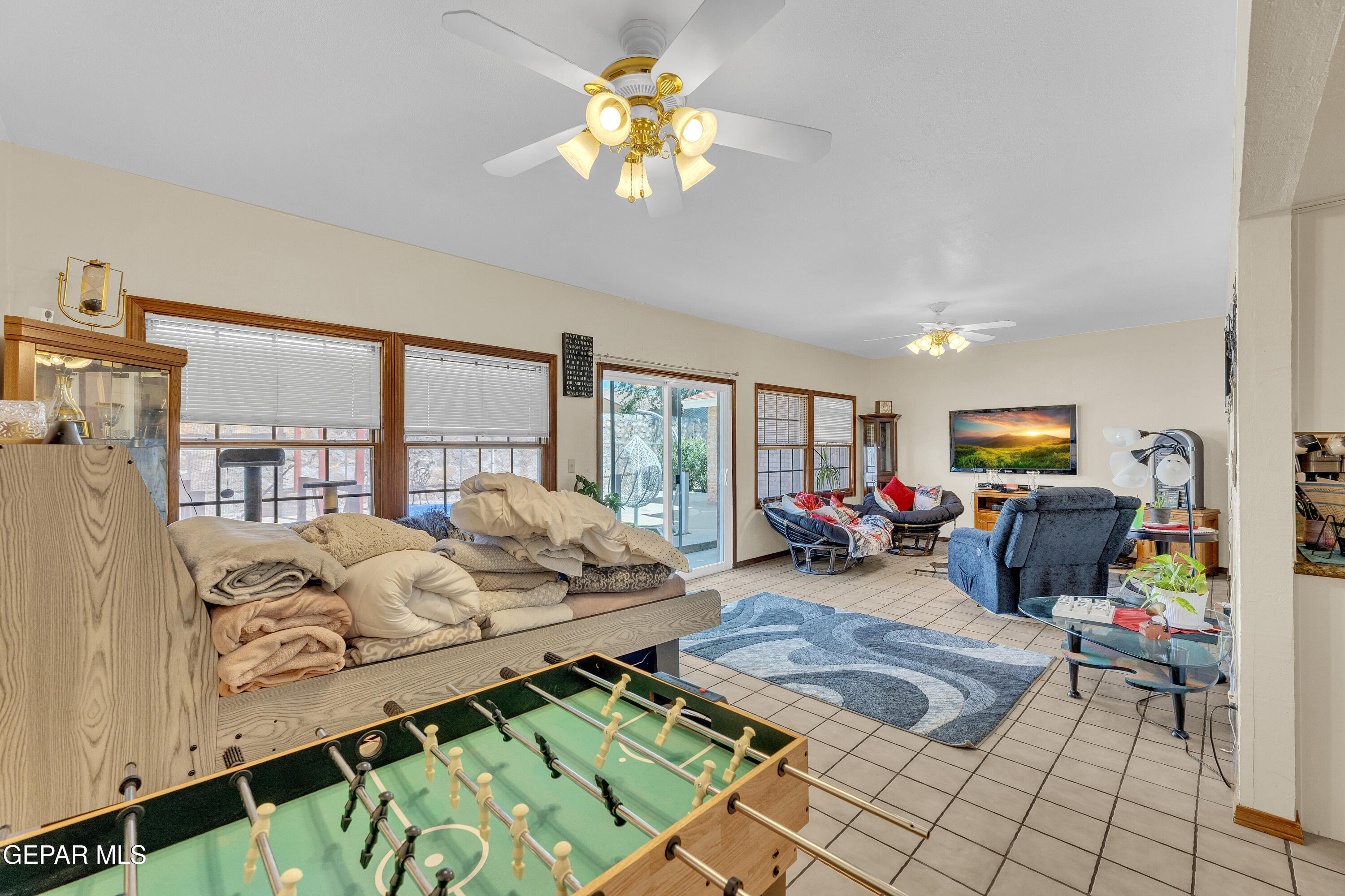 1664 Dick Ritter Street El Paso, TX 79936 - Photo 17 of 65 a living room with furniture fireplace and flat screen tv