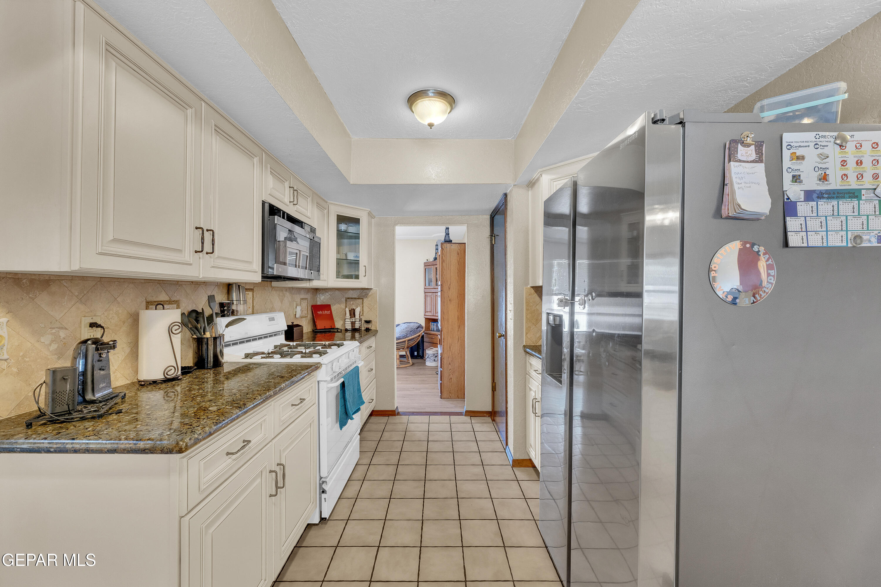 1664 Dick Ritter Street El Paso, TX 79936 - Photo 21 of 65 a kitchen with stainless steel appliances granite countertop a refrigerator and a sink