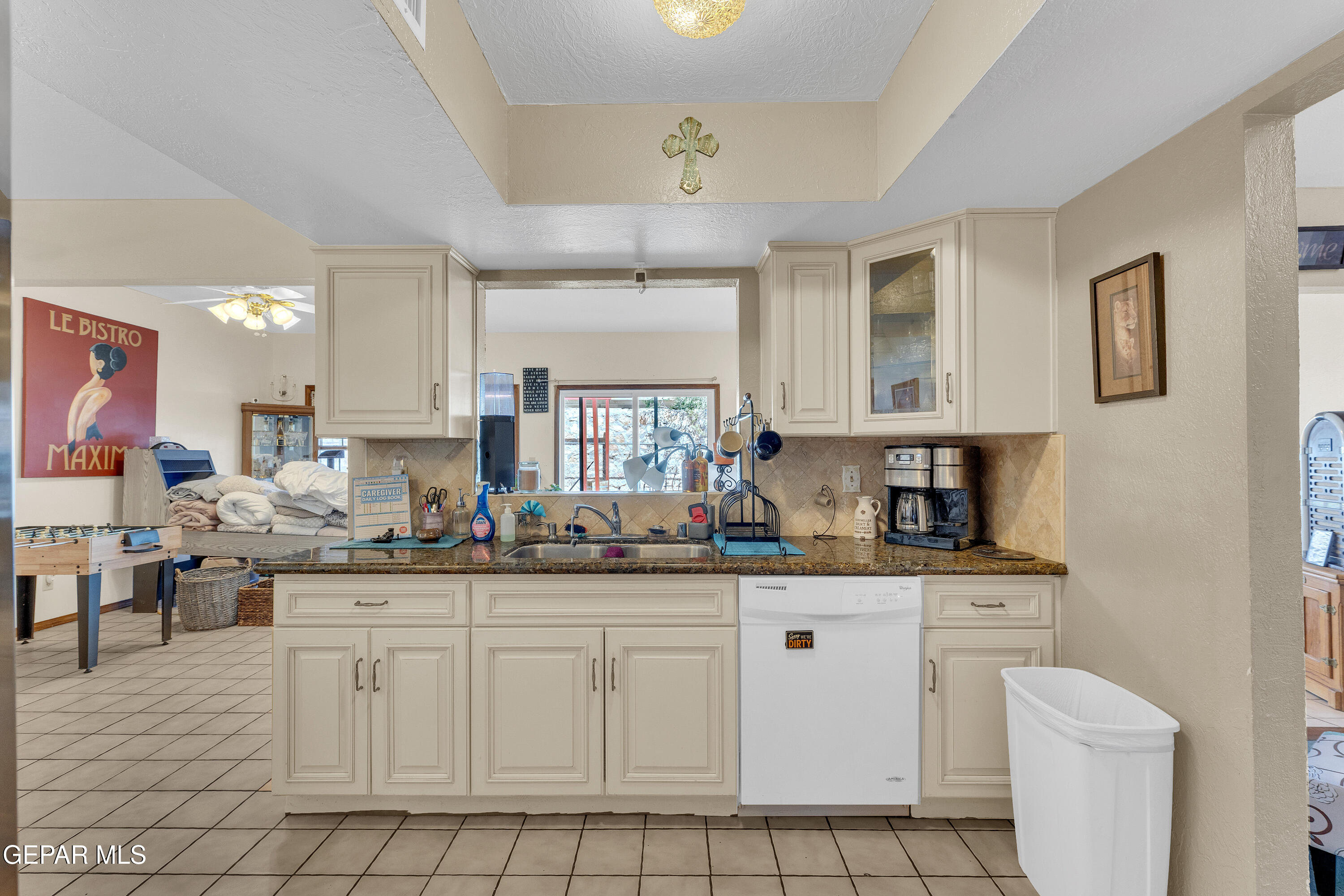 1664 Dick Ritter Street El Paso, TX 79936 - Photo 22 of 65 a kitchen with white cabinets and sink