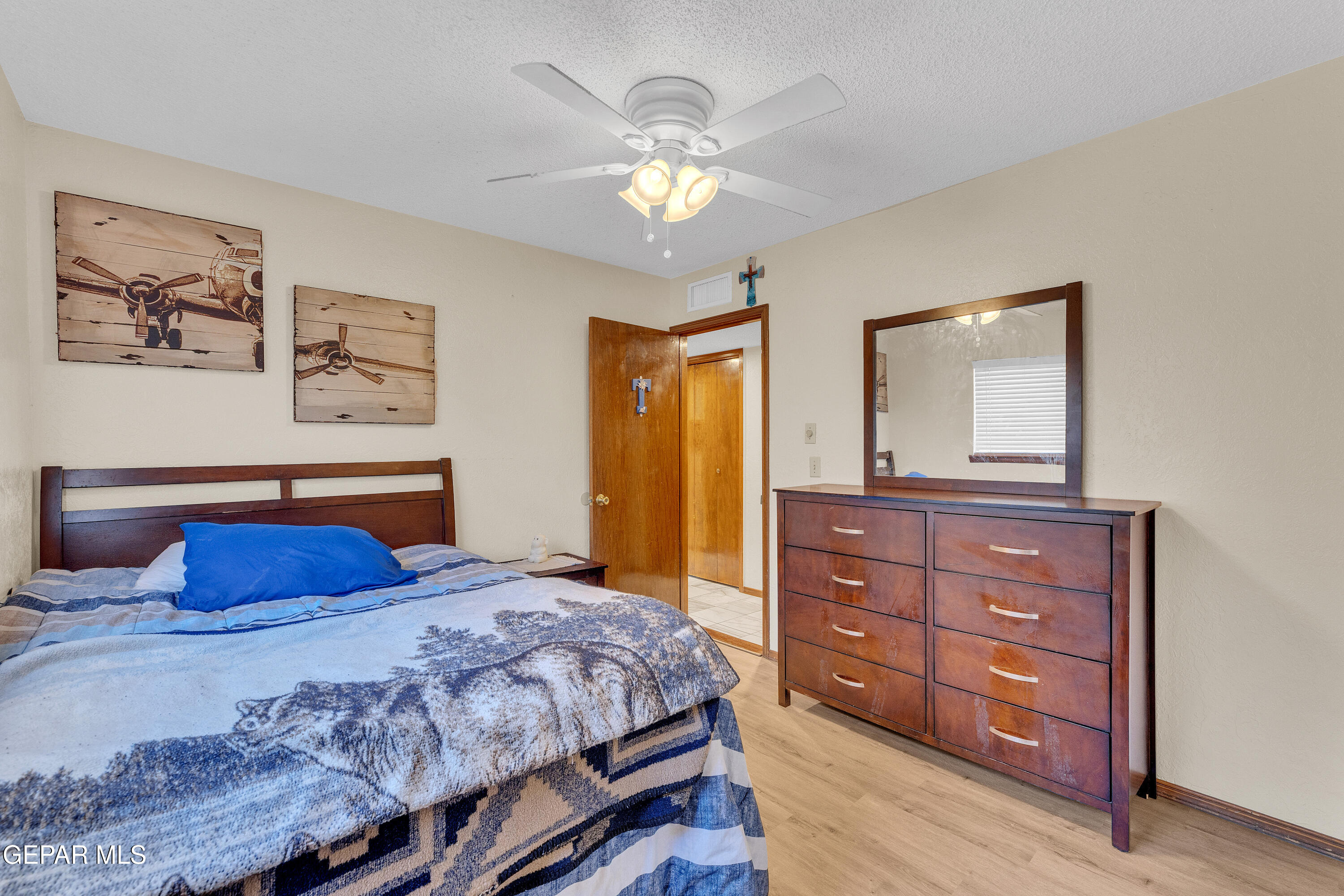 1664 Dick Ritter Street El Paso, TX 79936 - Photo 27 of 65 a bedroom with a bed and a dresser