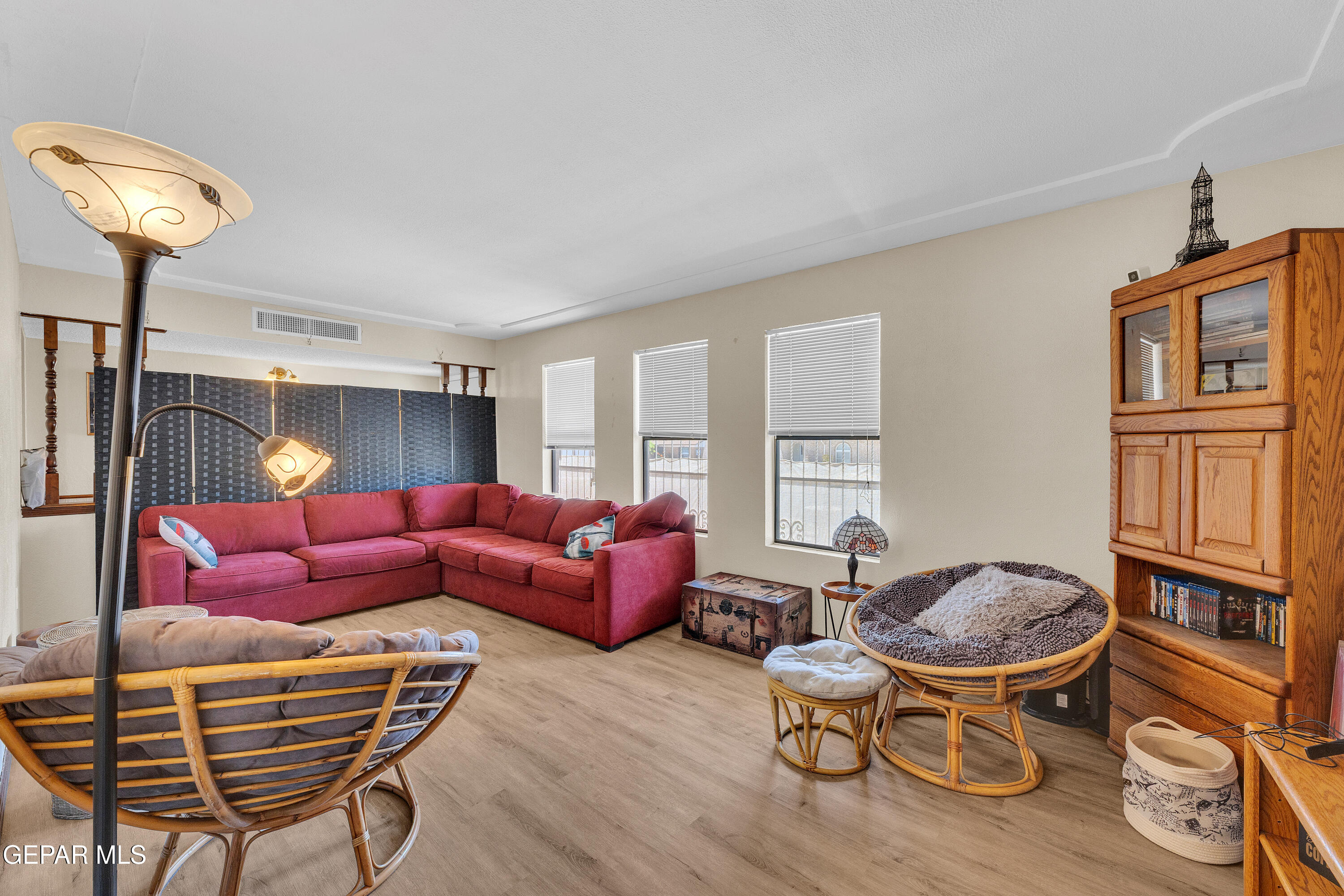 1664 Dick Ritter Street El Paso, TX 79936 - Photo 28 of 65 a living room with furniture a window and a chandelier
