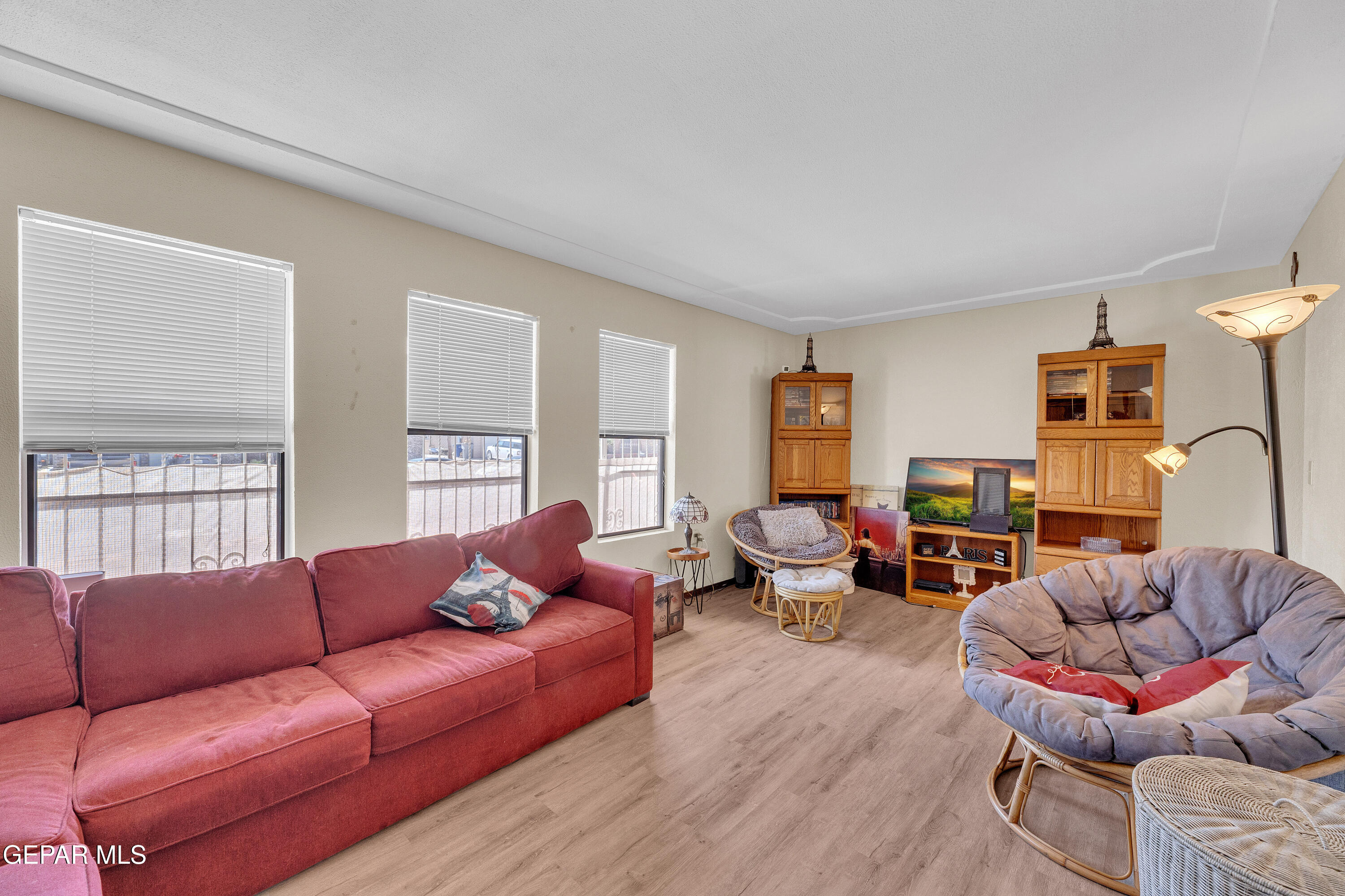 1664 Dick Ritter Street El Paso, TX 79936 - Photo 30 of 65 a living room with furniture wooden floor and a large window