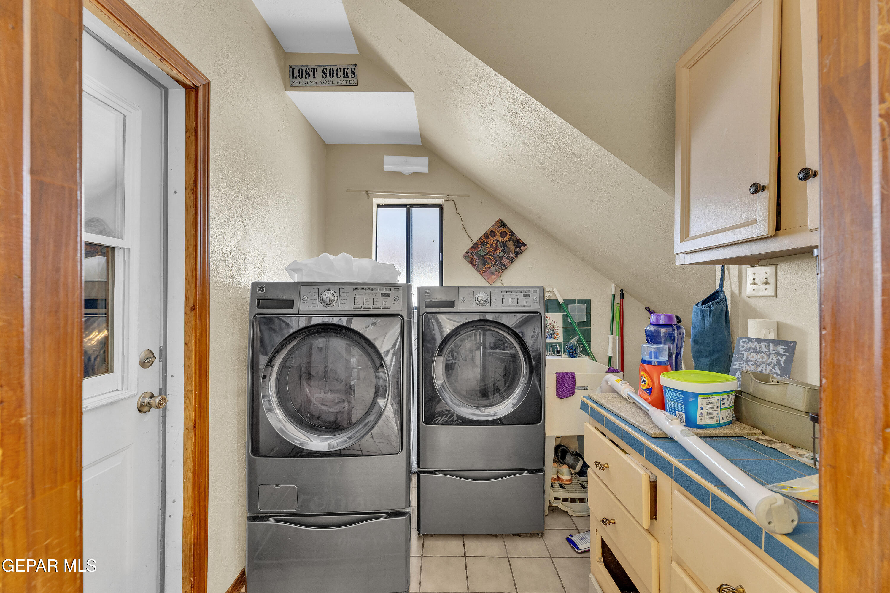 1664 Dick Ritter Street El Paso, TX 79936 - Photo 31 of 65 a utility room with dryer and washer