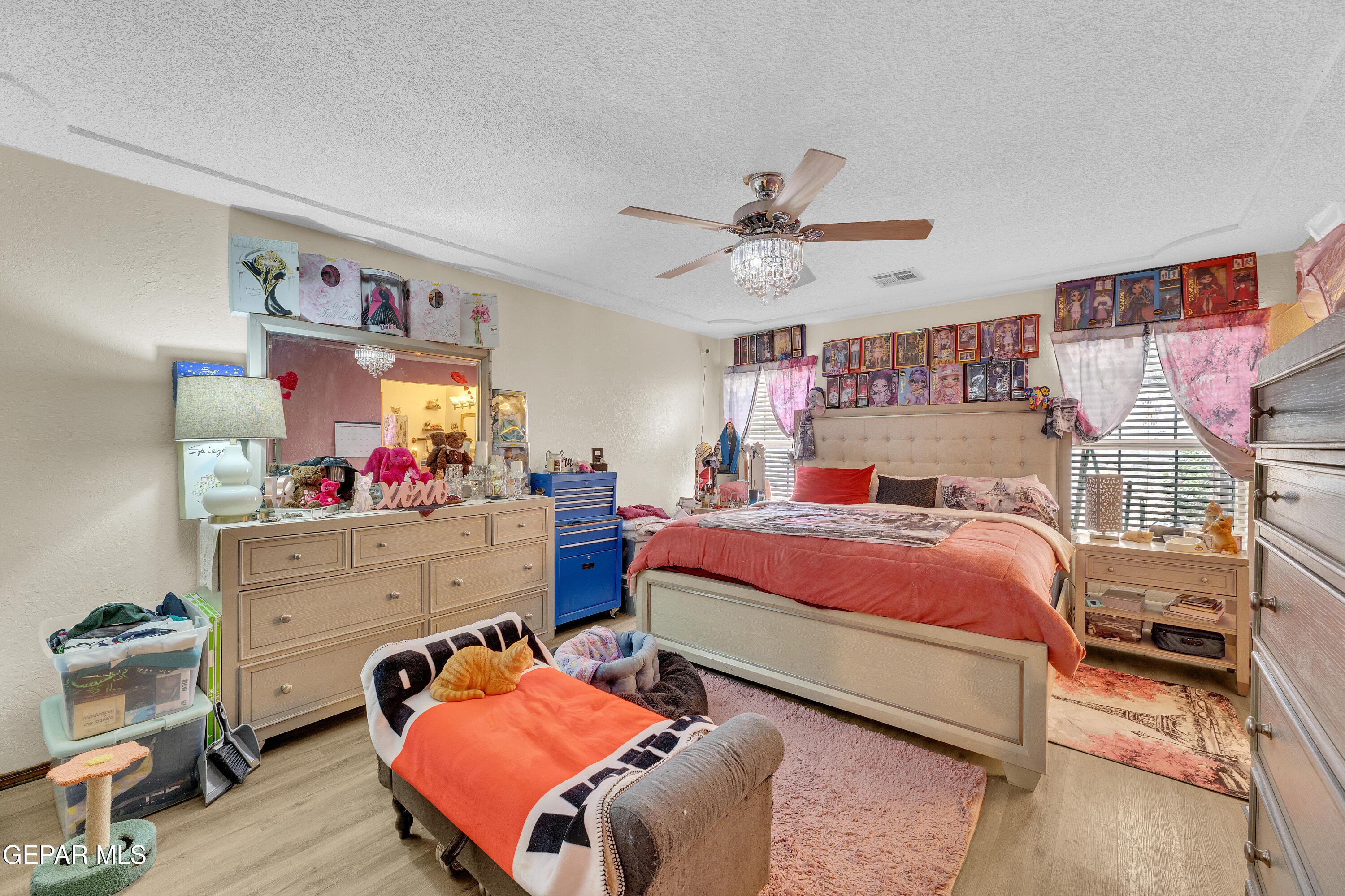 1664 Dick Ritter Street El Paso, TX 79936 - Photo 32 of 65 a bedroom with a bed and a chandelier