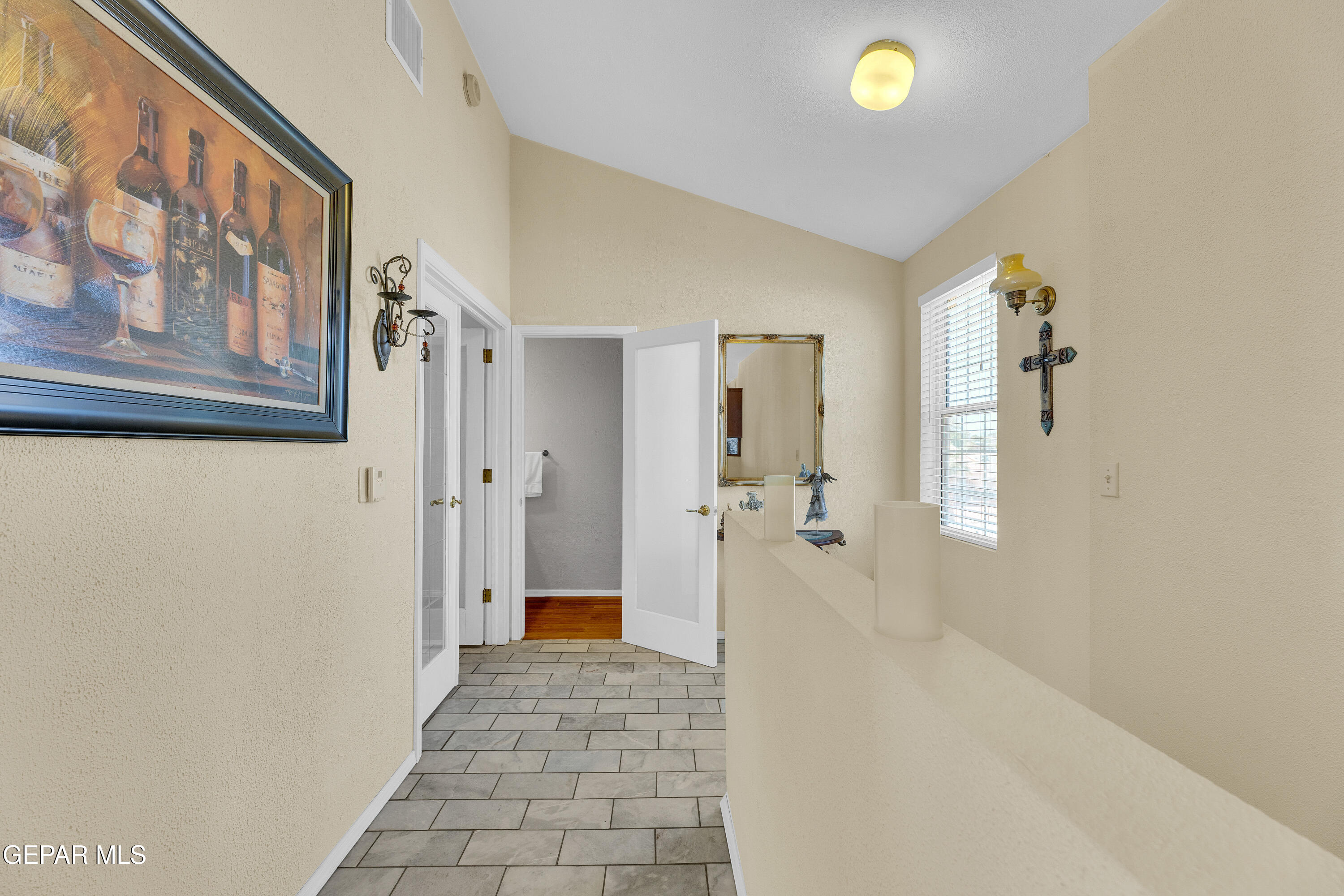 1664 Dick Ritter Street El Paso, TX 79936 - Photo 35 of 65 a view of a hallway with wooden floor and cabinet