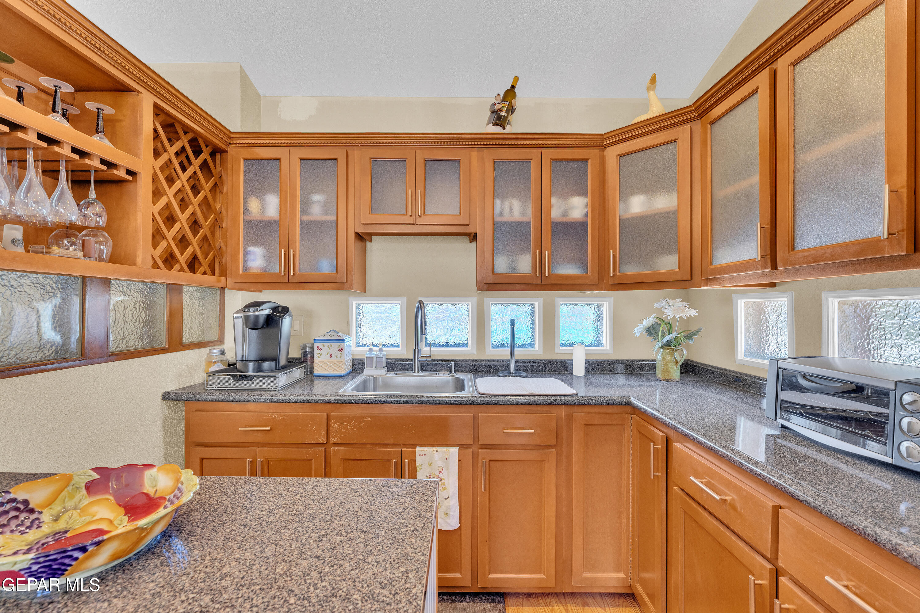 1664 Dick Ritter Street El Paso, TX 79936 - Photo 43 of 65 a kitchen with stainless steel appliances granite countertop a sink stove and cabinets
