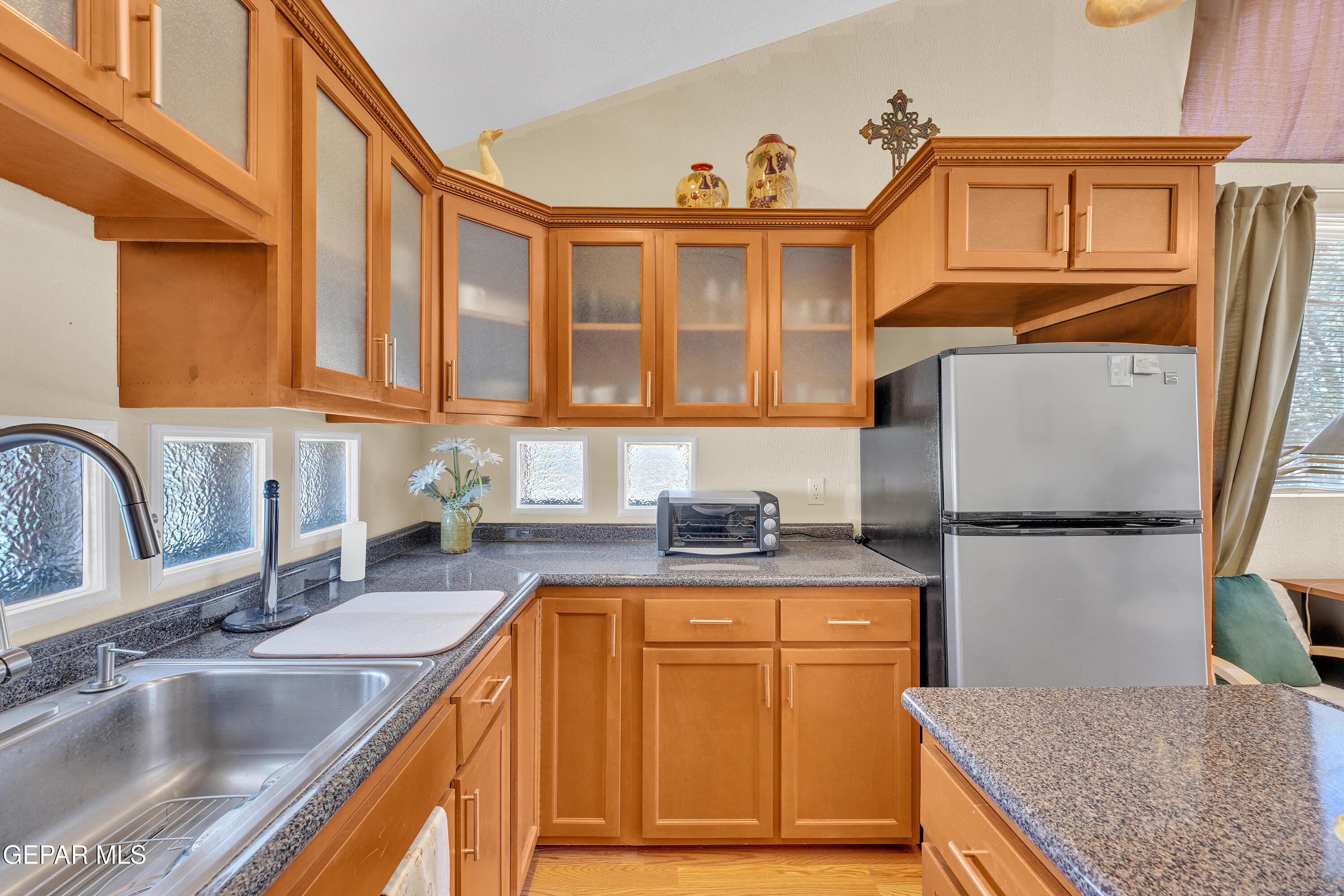 1664 Dick Ritter Street El Paso, TX 79936 - Photo 45 of 65 a kitchen with stainless steel appliances granite countertop a sink stove and cabinets