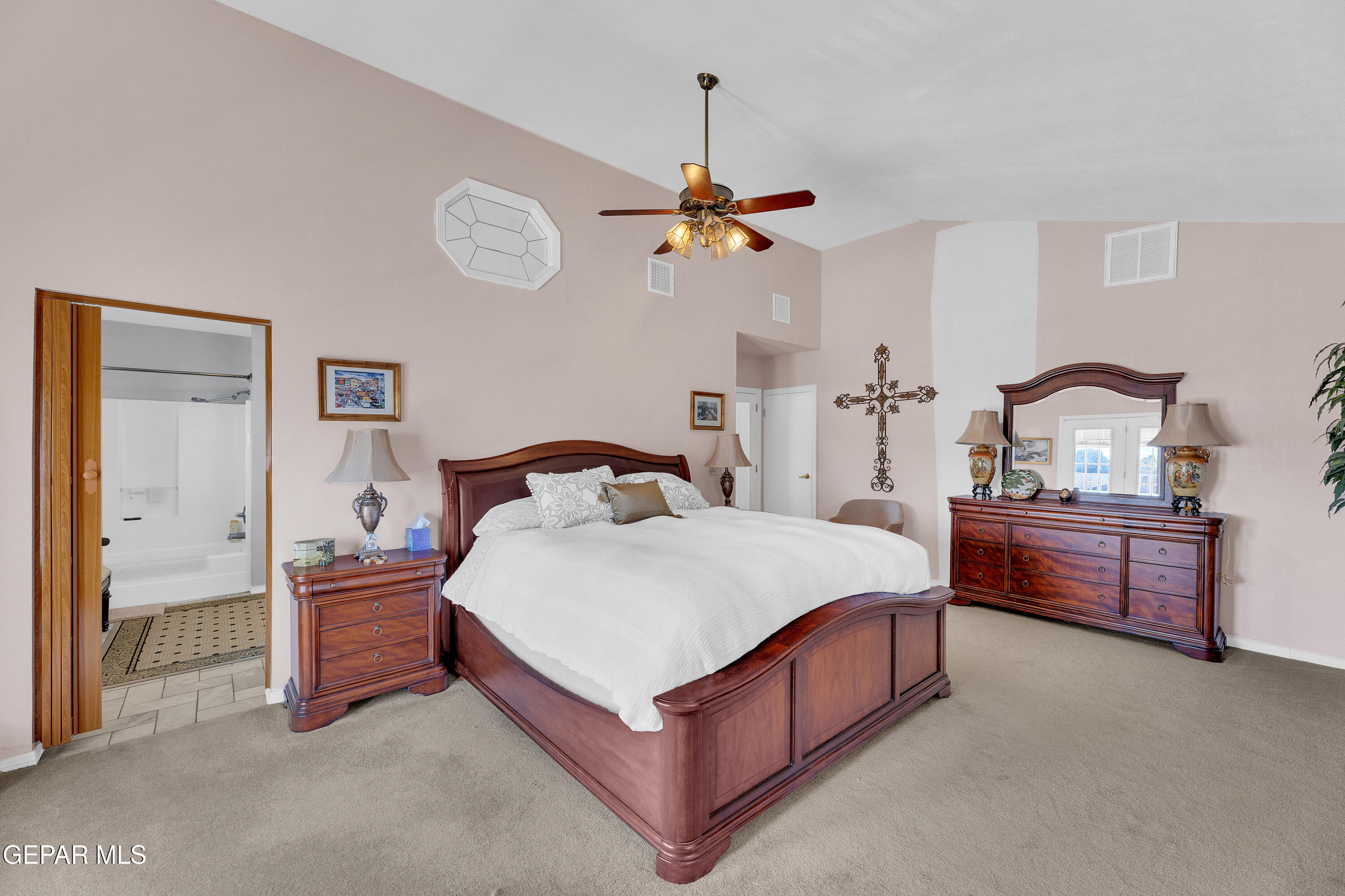 1664 Dick Ritter Street El Paso, TX 79936 - Photo 48 of 65 a bedroom with a bed and a chandelier