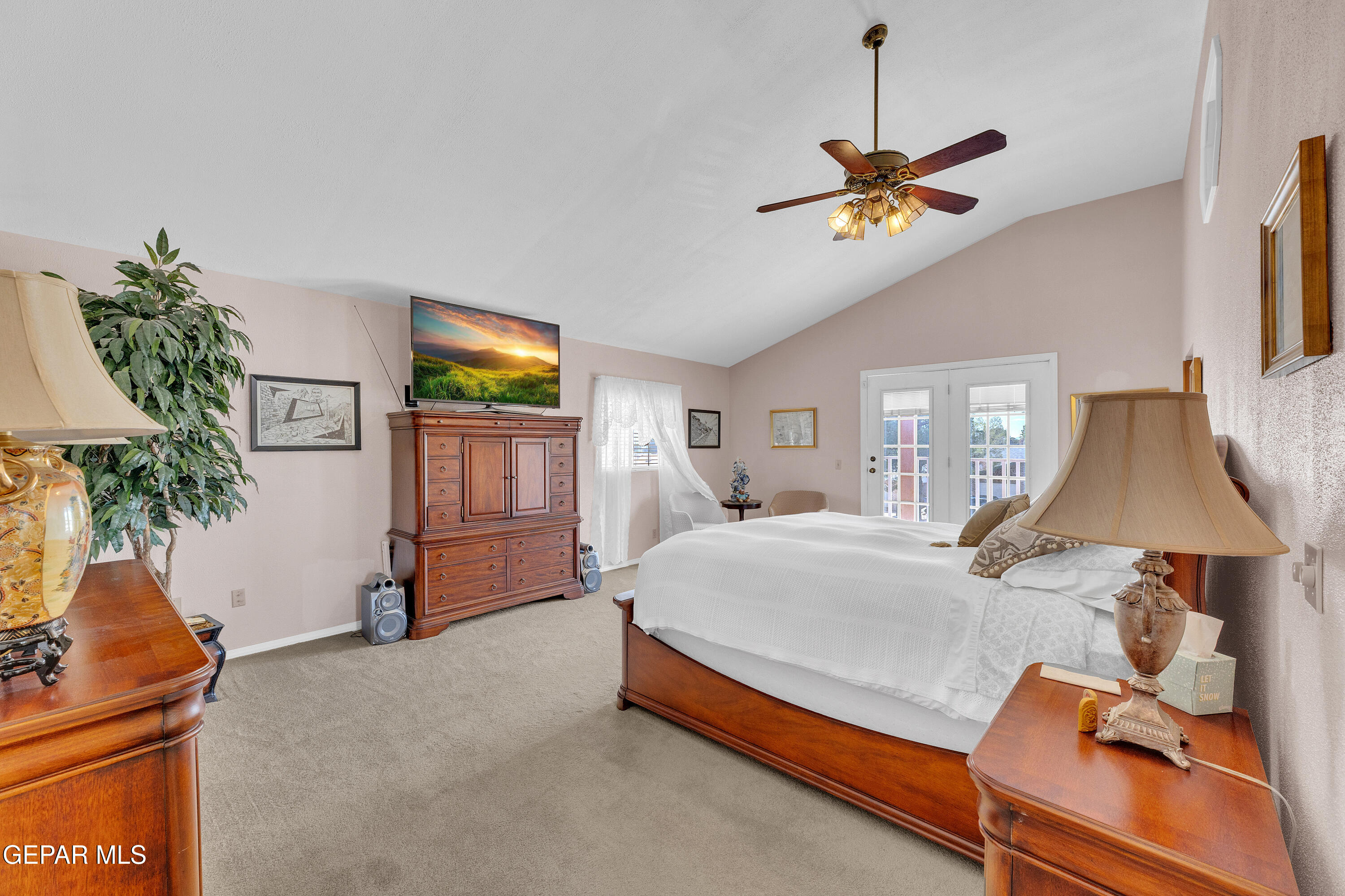 1664 Dick Ritter Street El Paso, TX 79936 - Photo 50 of 65 a bedroom with a bed and a chandelier