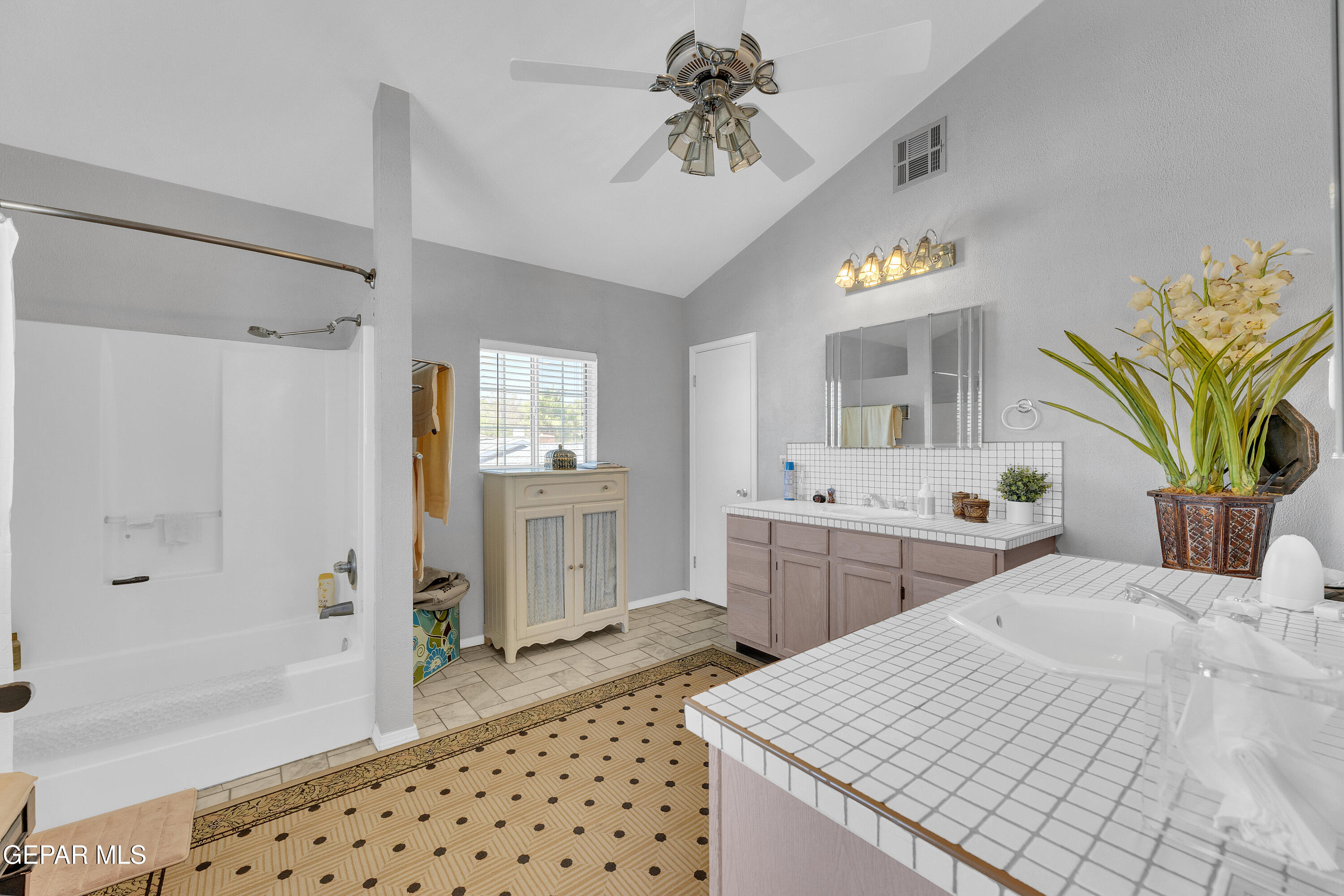 1664 Dick Ritter Street El Paso, TX 79936 - Photo 51 of 65 a bedroom with a bed and a chandelier