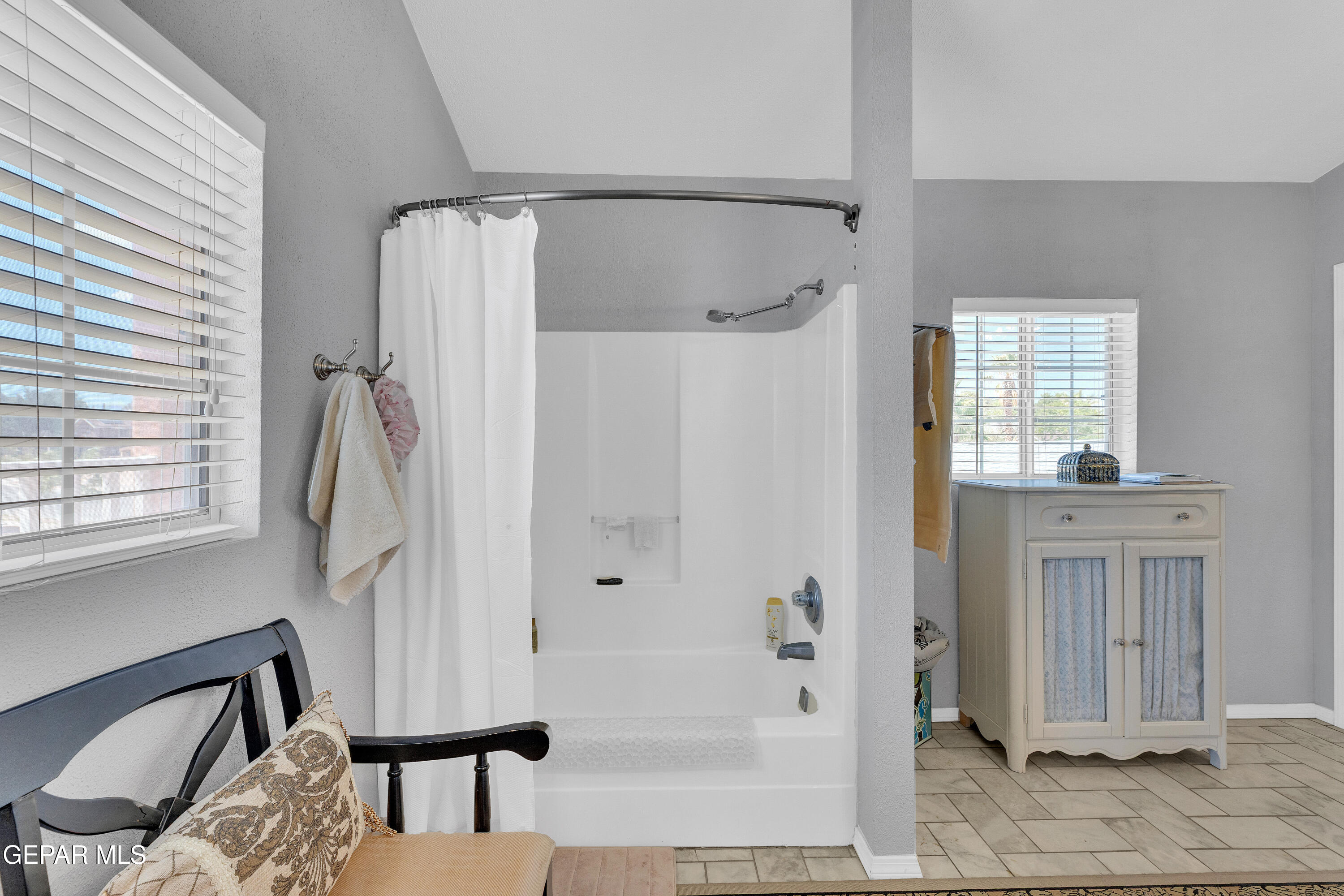 1664 Dick Ritter Street El Paso, TX 79936 - Photo 54 of 65 a bathroom with a shower bathtub and a shower